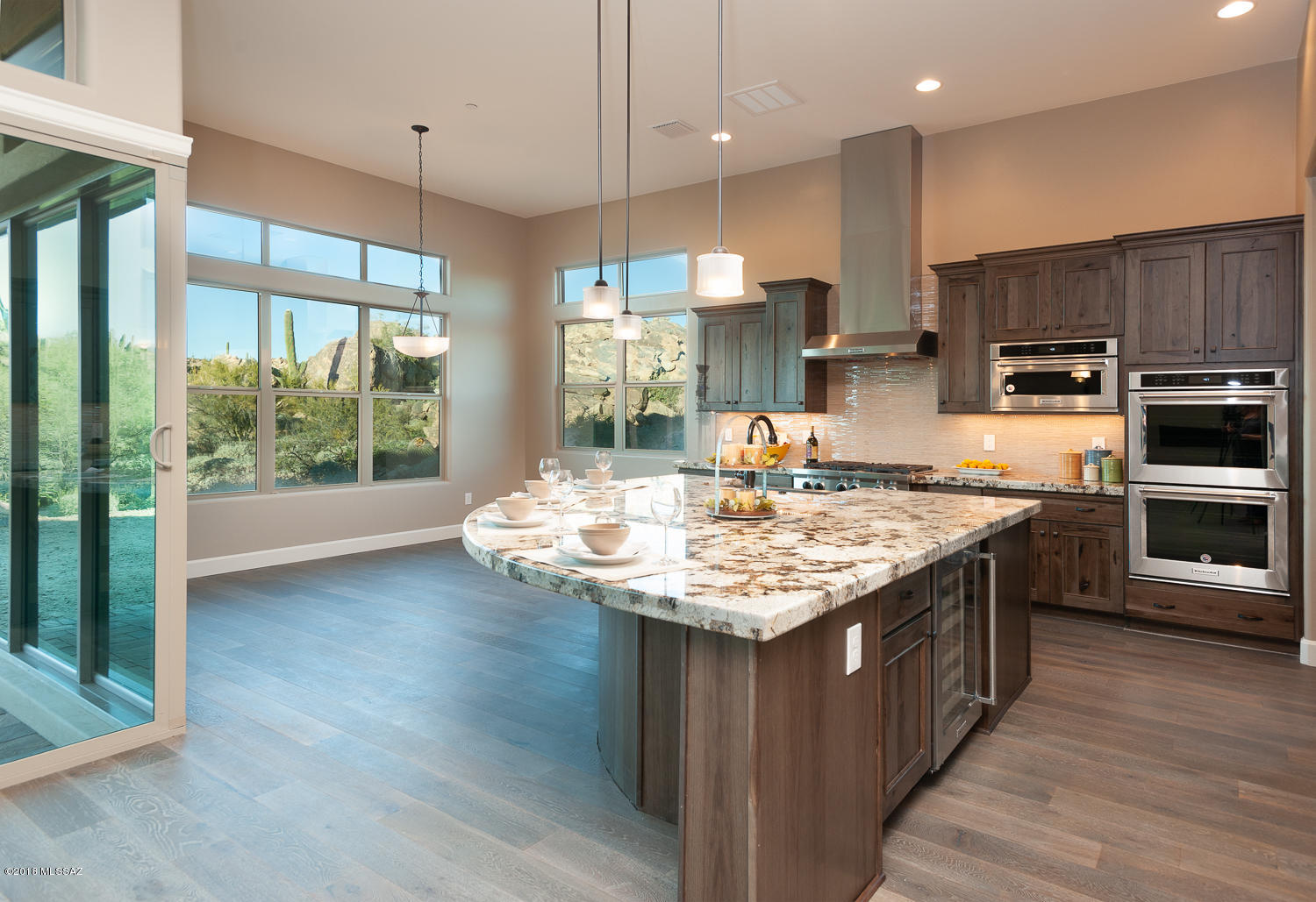 Newly completed Monterey Luxury Home, in prestigious Stone Canyon, located on a cul-de-sac lot with numerous boulder outcroppings surrounded by natural desert. Home is perfect for entertaining with an oversized kitchen island overlooking the dining nook & great room, flowing out to the covered patio. A master wing embodies classy tranquility with a gorgeous tiled shower, double vanities and freestanding tub. Home boasts many upgrades including Karman Rustic Hickory cabinets with 42'' uppers, Kitchen Aid Appliances including a wine chiller, gorgeous Copenhagen Granite, wood plank floors, 48'' gas fireplace & 2 large corner multi-slide doors at rear patio. Call agent for full list of amenities, personal tour of the home, & Phil Mickelson's Stone Canyon Club (featuring world class golf & fitness facilities, new Clubhouse, and the fabulous setting of the restaurant and bar).