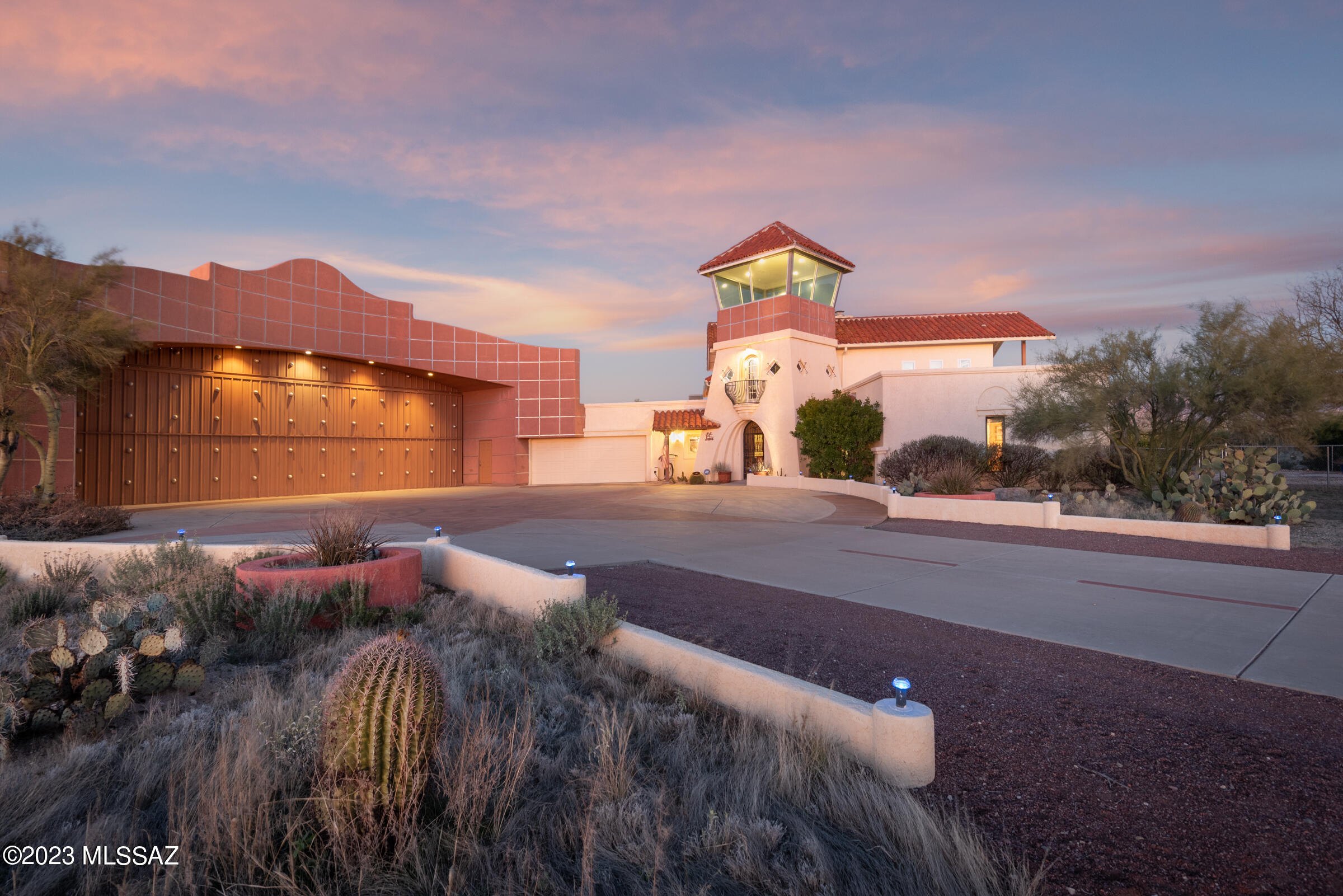 One of a kind La Cholla Airpark home with large 60'x50' hangar with 45' bi-fold Schweiss door close to runway. Nothing beats the main advantage of living in a fly-in community with the opportunity to get up in the air easily & often. What better way to enjoy that feeling than to live in a community where it can be shared & appreciated by like-minded friends. La Cholla Airpark offers that as well as benefits of living in the heart of Oro Valley on secluded 8+acre property yet close to amenities. Custom ''tower'' offers 360° views with Tucson's Mountain ranges all on display. Kitchen has stainless appliances & breakfast bar open to family room/dining area with fireplace & wall of windows where the views pour in.  Cozy living room has raised hearth fireplace. Built in 1985 this 3,249sf, 3BR, 3½BA home has a unique southwest style. Master suite is on main floor & additional master suite on the second floor has balcony. Fenced backyard has heated pool with in floor cleaning system & Kool decking. Two solar powered evap in hangar. Solar water heater. Oversized two car   garage + 6 car garage/hangar. RV Parking area with power, water, and septic dump. Room for planes, cars & all adult  recreational toys.