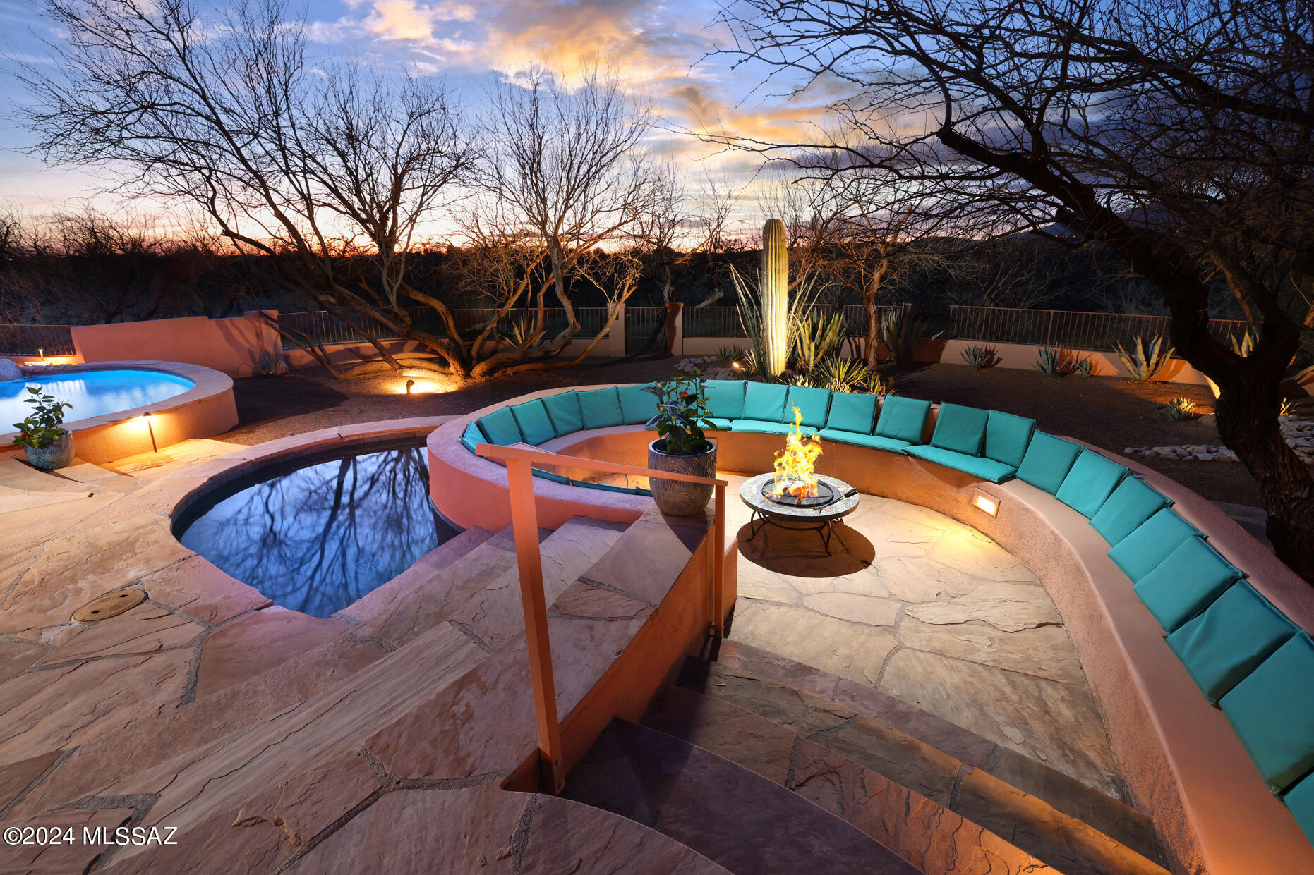 Stunning Contemporary Santa Fe home nestled in the Tanque Verde Valley. This beautiful 4 bedroom home also includes a separate guest house/studio with half bath. Set on almost an acre, the home backs up to open space. The Resort like backyard offers a sparkling pool & spa, a wood burning Kiva fireplace & separate sunken conversation seating area. Inside a remodeled kitchen opens to Family room with high ceilings, gas fireplace & walls of windows looking out into the backyard. A separate Formal Dining room & Living room for additional space. Spacious Primary Suite w/garden tub, full shower & special touches.  Guest rooms (3) located on opposite side of home.  Charming neighborhood w/Mountain views on Cul-de-Sac. Close to schools, shopping, golf & hiking. A very special place to call home! THE PROPERTY
"	2858 Square foot Santa fe style main home, with 578 sq foot Guest House/Studio
"	.78 acres with Mountain Views and large open space behind
"	3 car garage with Cabinets
"	Resort like Backyard
"	Beautiful Pool & Spa, artist designed with waterfall & natural stone edge
"	All new Pool equipment in 2019
"	Large Covered back patio with seating area and pull down sun shade
"	Outdoor Kiva wood burning fireplace 
"	Separate sunken conversation seating area
"	Fire prevention sprinkler system outside fence
"	House painted in last two years
"	Newer HVAC (2 units)
"	Water Heater replaced 2020
"	Pool subpanel with support for electric kiln
"	Guest House/Studio has electric roller window sun shade
"	Metal frame for shade of firewood
"	Close to Schools and hiking trails

HOUSE
"	4 bedroom, 2 ½  bath in main house, Studio & ½ bath separate building
"	Newly Remodeled Kitchen
"	Large Family Room with Fireplace
"	Separate Dining Room 
"	Living Room 
"	Split Floorplan
"	Remodeled Guest Bath & Powder Room
"	Custom turtle tile design in entry way

KITCHEN
"	Newly Remodeled Bright kitchen opens to Family room
"	Beautiful Cherry wood cabinets w/soft close, full extension, dovetailed drawers
"	Quartz Counter tops
"	Tile backsplash
"	Views out Kitchen and Family Room Windows
"	Newer Slate Gray appliances
"	Walk-in Pantry
"	Barstool seating
"	Under cabinet lighting
"	Waterproof vinyl tile floor

PRIMARY SUITE
"	Door to backyard
"	Kohler Garden Tub
"	Two separate vanity areas & make up area
"	Large walk-in shower 
"	Plenty of Closet Space
"	Private enclosed garden space