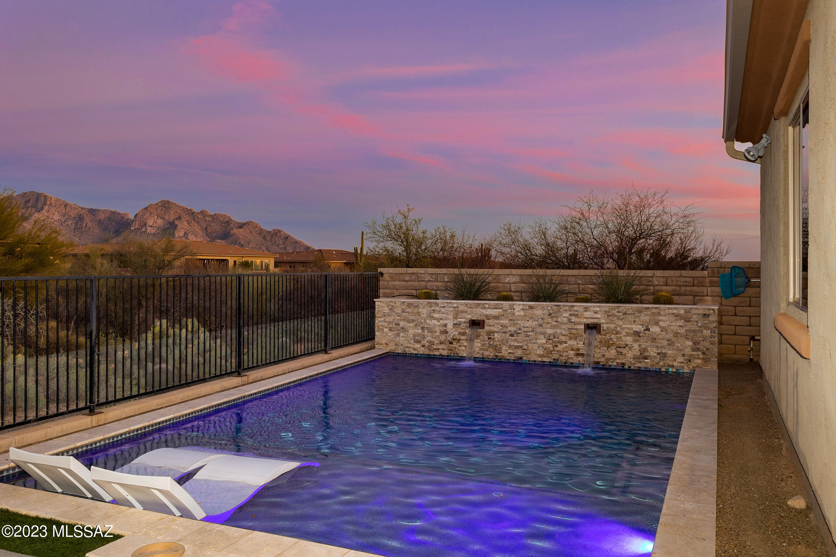 ''The HOME is where the Heart is'' and this gorgeous home truly has it all! The minute you walk through the door you feel a warm and inviting feeling that flows through out. 4BR|3BA, split floor plan, office + bonus room! The kitchen opens to the great room, formal dining area, with a breakfast nook and sit up bar.  Wonderful space for family gatherings and entertaining. Stunning Mountain views from the backyard with open and private space.  A true oasis in the desert! Sparkling pool with relaxing lounge area and peaceful water feature and covered back patio. There is plenty of space to customize your dream backyard! Large 3 car tandem garage. Neighborhood features are gated community, park, close to schools, bike trails, restaurants and more!