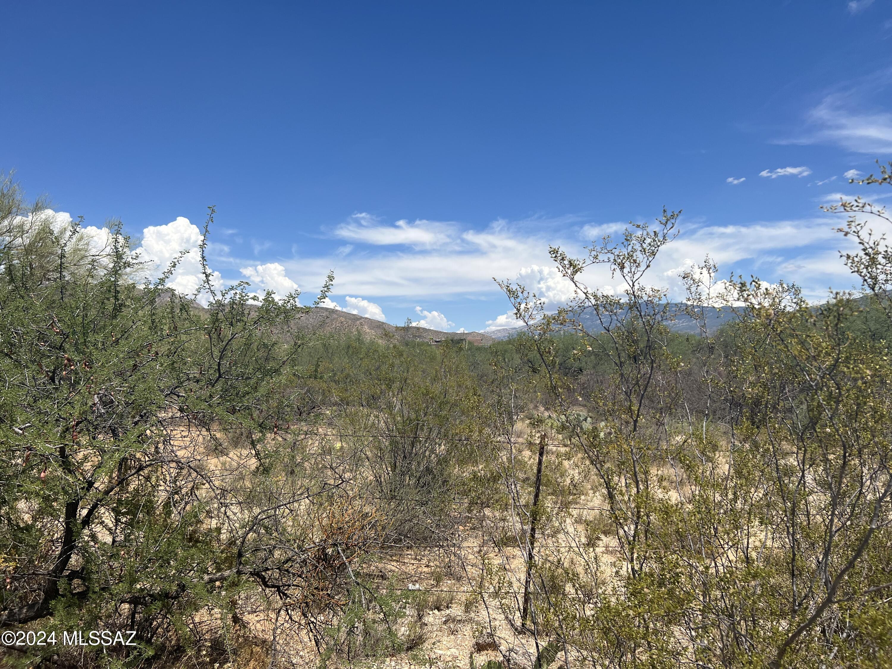 Vacant land lot of 9.93 Acres with GORGEOUS VIEWS of the Catalina & Rincon Mountain ranges in Northeast Tucson! This lot is meant to be broken into three parcels of 3.31 Acres each. The lot is located minutes from Agua Caliente Park. Perfect lot to build your dream home! Utilities at lot line.