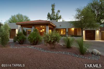 Catalina Vista at it's finest! Stunning large SW Contemporary has beautiful large porcelain tiled floors throughout,open flr plan has living, dining area open to large kitchen w/center island,granite,top of line appli,walk-in pantry.3 large bedrooms each w/on suite bath's,Gstrm w/private entrance, 1/2 ba for guest,sep office,large outdr living area,plus sep full 2bd 1 bath gsthse, kitchen laundry etc! Beautifully landscaped front and back, walled backyard is super private,central vac,2 car garage on.35 acres of land!don't miss the outdoor shower!Walk to Banner Hospital Modern street car restaurants and more!