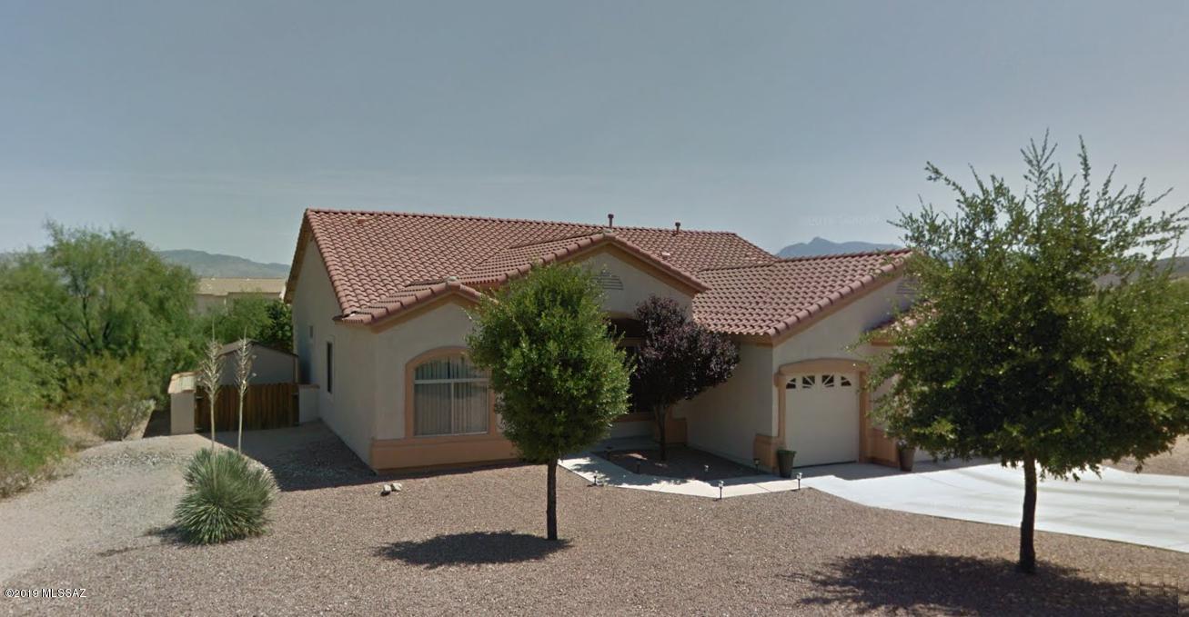 Relax in this spacious 3-bedroom, 2-bathroom contemporary style home in the desirable Rancho Del Lago community in Vail, AZ. Located southeast of Tucson and just minutes from I-10, Colossal Caves, and the Saguaro National Monument, This well maintained home has an office/den, large up-graded kitchen with double-oven, breakfast bar, walk-in pantry, living area with a wall of windows, built-in shelves, and a fireplace. Also has a beautifully landscaped backyard, spacious master bedroom and master bathroom with garden tub and dual sinks, 3-car garage, covered patio, and mountain views.