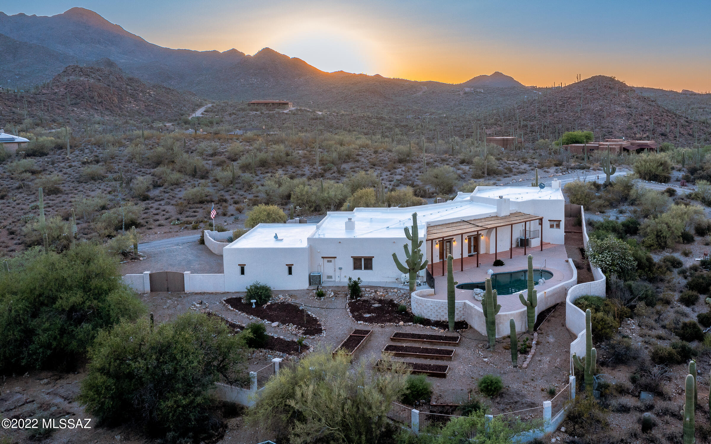 Within minutes of Sweetwater Preserve, this home boasts spectacular mountain & city views w/stunning sunrises & sunsets to begin & end each day. Sweetwater Pres. offers 800+acres along the Tucson Mtns w/15 mi of trails, equestrian access, hiking, mtn biking, trl running!! The 4 bed, 3 bath, 3 car garage home is very private w/walled in huge front & rear yards, making for a perfect oasis, yet approximately 20 minutes from shopping & dining.  You'll love the SW flare of the home where most rooms have doors leading to the outdoors. Take in the saguaro studded views through your windows while looking up to tall ceilings w/viga beams. The home has a salt water pool, roof fully serviced (warranty), & a new septic tank (2020)!  Too much to list. MUST VIEW: VIDEO, FEATURE LIST,3D & 2D FLOORPLANS!!