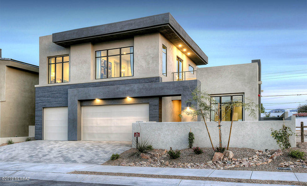 Ideally positioned in central Tucson with easy access to U of A, Banner Hospital, Downtown, Restaurants & shopping.
his home has a great room that SCREAMS GREAT!  The expansive living/dining/kitchen, area opens up to a large covered rear patio made for entertaining with fully landscaped yard including  built in BBQ ,artificial turf ,palm trees and extended tiled deck.
Exquisite kitchen with SS Electrolux appliances, designer cabs, quartz countertops, & huge walk-in pantry..  Large laundry rm , mud rm ,powder rm & office finish off the main floor.
Spacious open, game rm & walk out deck highlight the upstairs living & entertainment space .
Upgraded finishes through-out  the  master bedroom suite with opulent master bath complete with free standing tub & shower
2 addl bedrooms with,hall This home is pre-plumbed for central vac and has a water softener loop.
It also included a complete sound system, mini -pad with docking station and complete security system.
Model home has been reduced provided closing take place on or before December 24th 2019