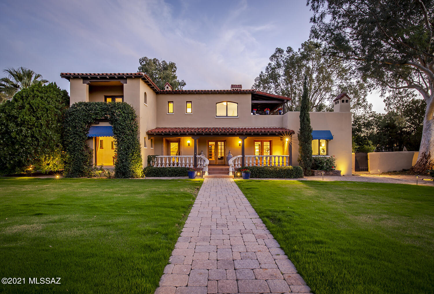Rare Spanish Mission house on the best lot in historic El Encanto. Elegantly restored to its original Spanish splendor. This 5br/6ba w/guest house is a stunner w/great natural light throughout, amazing mountain views and greenery. Grandiose features include living rm w/mahogany doors and beautiful fireplace overlooking gorgeous yard; an amazing kitchen that's second to none w/top notch inset cabinetry & Viking appliances (6 burner stove) w/breakfast nook overlooking garden (kitchen includes a wet bar):; large master suite (downstairs) w/fireplace & double vanity sinks, walk-in shower, clawfoot tub & plenty of closet space; spacious dining rm w/mountain views; en-suite finished basement w/its own heating/cooling unit. Great outdoor patio spaces throughout offer unique private areas. Award winning pebble tec pool.  Gorgeous wood floors throughout.  All plumbing and electrical have been updated.  All windows have been replaced (vintage looking yet high efficiency wood interior-aluminum exterior). Irrigation system recently replaced.  Amazing guest house (built as a guest house) w/its own kitchen, br & living RM.  Plenty of overflow parking.  Power lines have been buried (significant expense).  Short distance to restaurants, UofA, parks, golf, movie theater and downtown Tucson.   Houses of this caliber rarely become available.  Please see historical write up on house under the document section.