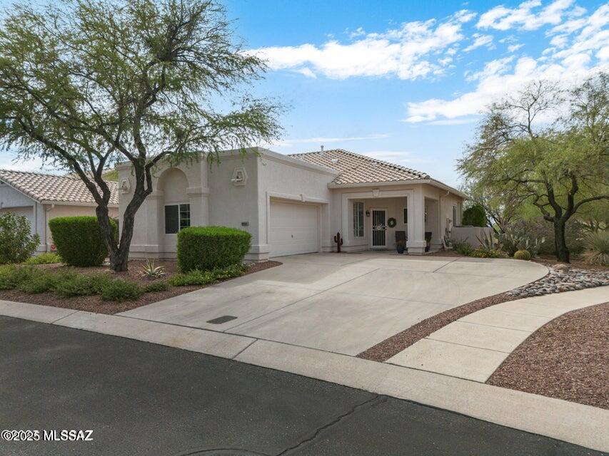 Brand new roof! and fantastic location. Impeccably maintained beauty located in the coveted gated community of Carmel Pointe adjacent to the Oro Valley Community Center, Canada Hills & El Conquistador Golf courses, Pickle Ball & Tennis Club. A short walk to golf, tennis, pickle ball, fitness, or swimming & a quick trip to the library & shopping. Prime location is perfect for young professionals, retirees, snowbirds, or the fitness enthusiast. This home features a bright & open floor plan with ceramic tile flooring throughout & custom plantation shutters. The kitchen showcases granite counters, stainless steel appliances, & lots of cabinets. Kitchen accepts gas or electric (installed) range. Step outside onto your beautifully landscaped private patio & grilling station.