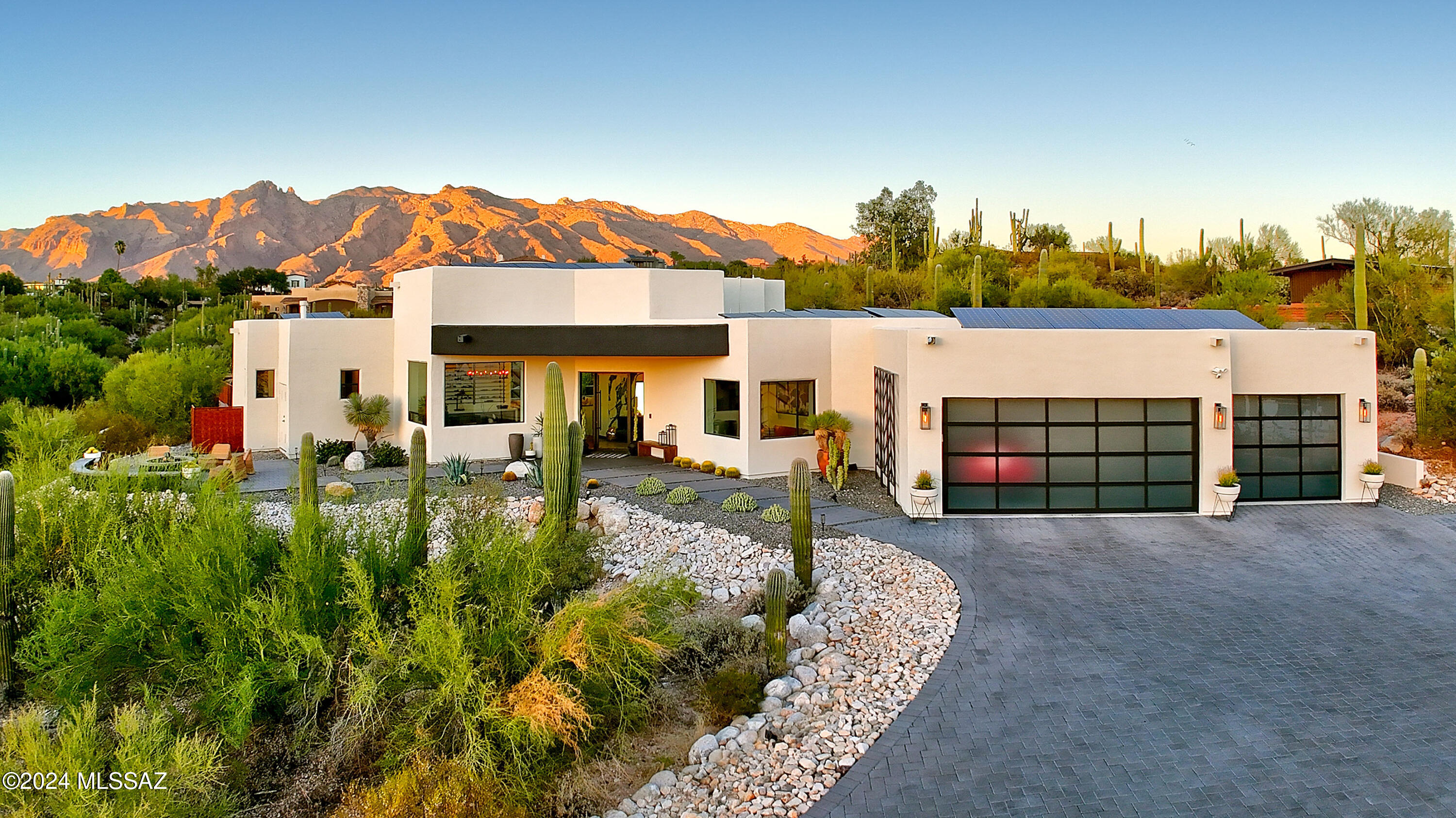 *DESERT SANCTUARY*  INCREDIBLE *MODERN* BLEND OF SW FLAVOR & SOPHISTICATION!
 THE ARCHITECTUAL DESIGN EMBRACES THE WONDERS OF THE DESERT...PANORAMIC MTN RANGES, VIBRANT CITYSCAPES & THE BEAUTY OF OUR SONORAN DESERT! THE MAGIC BEGINS AS YOU ENTER THIS UNIQUE ESTATE... COMBINATION OF STYLISH & CHIC DECOR FINISHES MAKE THIS HM UNFORGETABLE! THE HEART OF THE HM IS THE DRAMATIC ''GREAT'' RM-WALLS OF GLASS CAPTURE THE ENTIRE SANTA CATALINA MTN RANGE, 15 FT CEILINGS, DREAM KIT- MATTE BLK ''CAFÉ'' APPLIC, QUARTZ CTRS- 16 ' ISLAND! ENJOY YOUR OWN ''PRIVATE'' OASIS... OYNX LAP POOL (23 YARDS)  IS THE HIGHLIGHT  FRAMING THE CATALINA MTNS,  BUBBLING SPA, ALFRESCO KIT/DINING- EVEN OUTDOOR SHOWER! GUEST WING 2 EN-SUITES, *BONUS RM- DEN, SOLAR OWNED! 3CAR GAR W/GLASS DRS + SHED! NO HOA- BRING YOUR TOYS