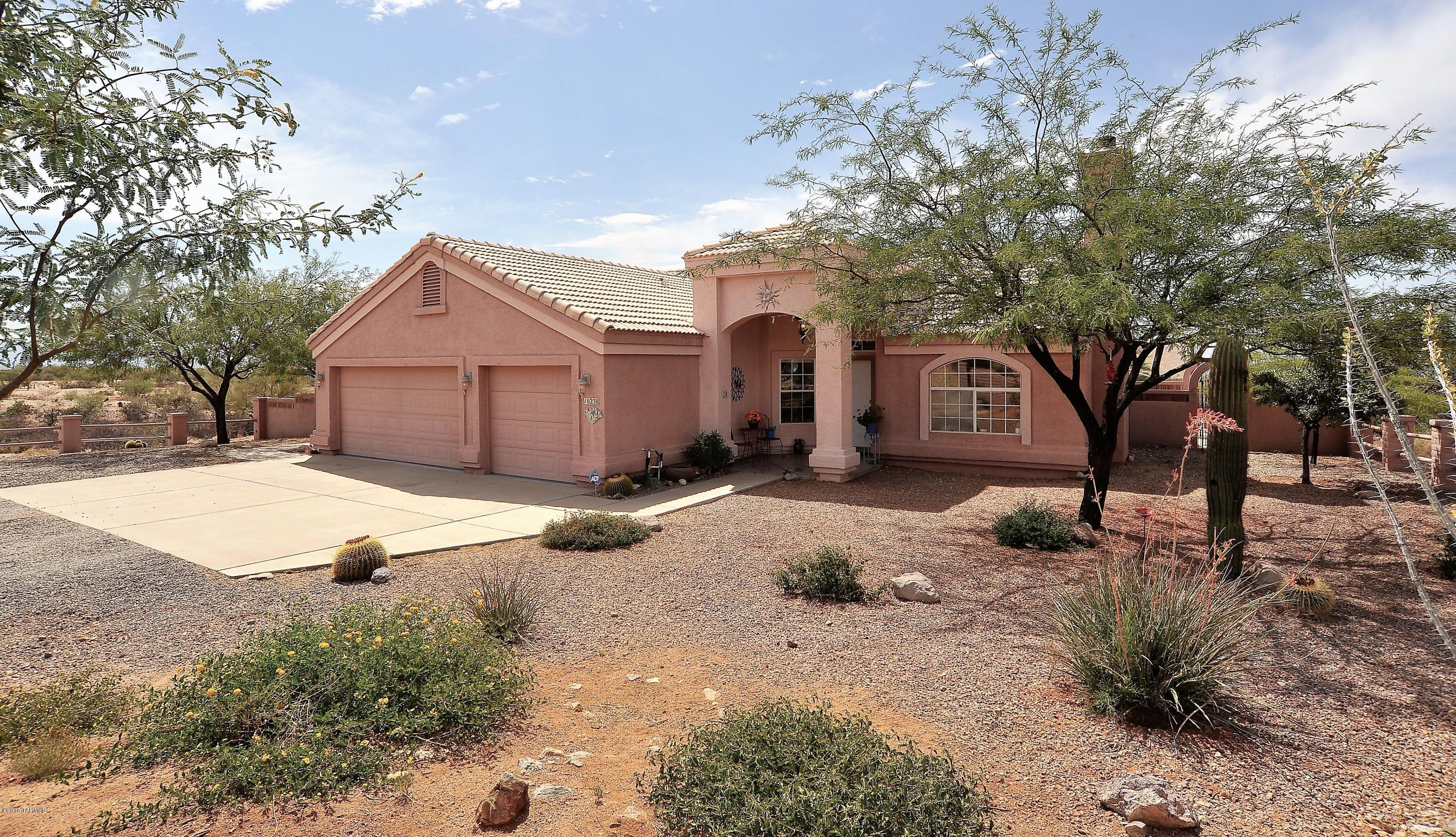 Seller will accept or counter offers between $250,000 and $270,000. This magnificent estate sits on a double lot and enjoys priceless views to the mountains and surrounded with desert life at its best where you will enjoy wildlife such as deer and beautiful desert flora. This home has been meticulously well maintained where pride of ownership is reflected throughout. Large living spaces enjoy recessed lighting, insulated energy efficient windows, ceiling fans and security system. The open floor plan features duet Blinds with large windows to enjoy the natural desert and a custom kitchen with under cabinetry lighting and modern white appliances. The Arizona room enjoys a spa and is independently heated and cooled. A sidewalk leads to the expansive fenced rear living space featuring upgraded outdoor lighting and lots of citrus, peach and plum trees. Additional features include two structures: a large detached structure with workshop, garage and A/C office/hobby room and a large attic for storage on the second floor and an additional 19.5 X 19 carport/storage building adjacent to the workshop can be used for multiple purposes. With plenty of room to entertain and to grow this home is unique in every way and can only be appreciated in person.