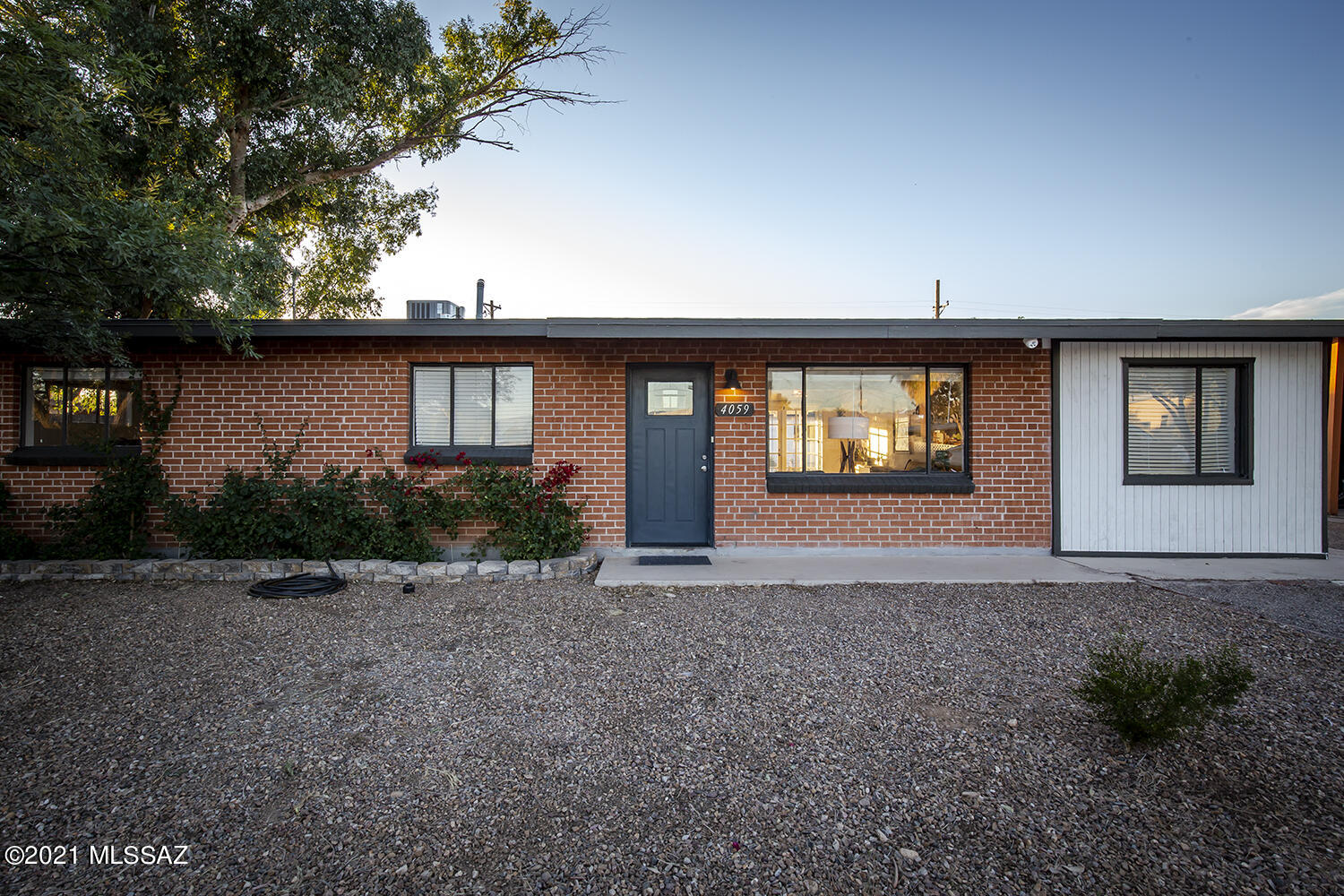 A sweet mid-century oasis conveniently located in a central part of town. Step into this 1959 solid brick home and find yourself never wanting to leave! A roomy 4 bedroom / 2 bath home with an approximately 300 sq ft. detached guest quarters (no kitchen /bath), studio or office. This house has plenty of designer upgrades to show off. The backyard is just as cozy and beautiful as the main house, with its garden nooks, fruit trees, patios and a converted space, the current owners used as a music studio, but could be a separate guest quarters or office space that steps out to view a gleaming pool! This house is a Tucson gem and perfect for entertaining! Conveniently located next to shopping centers, the Rillito river path, Trader Joes and Sprouts, and about just 12 min away from Downtown!