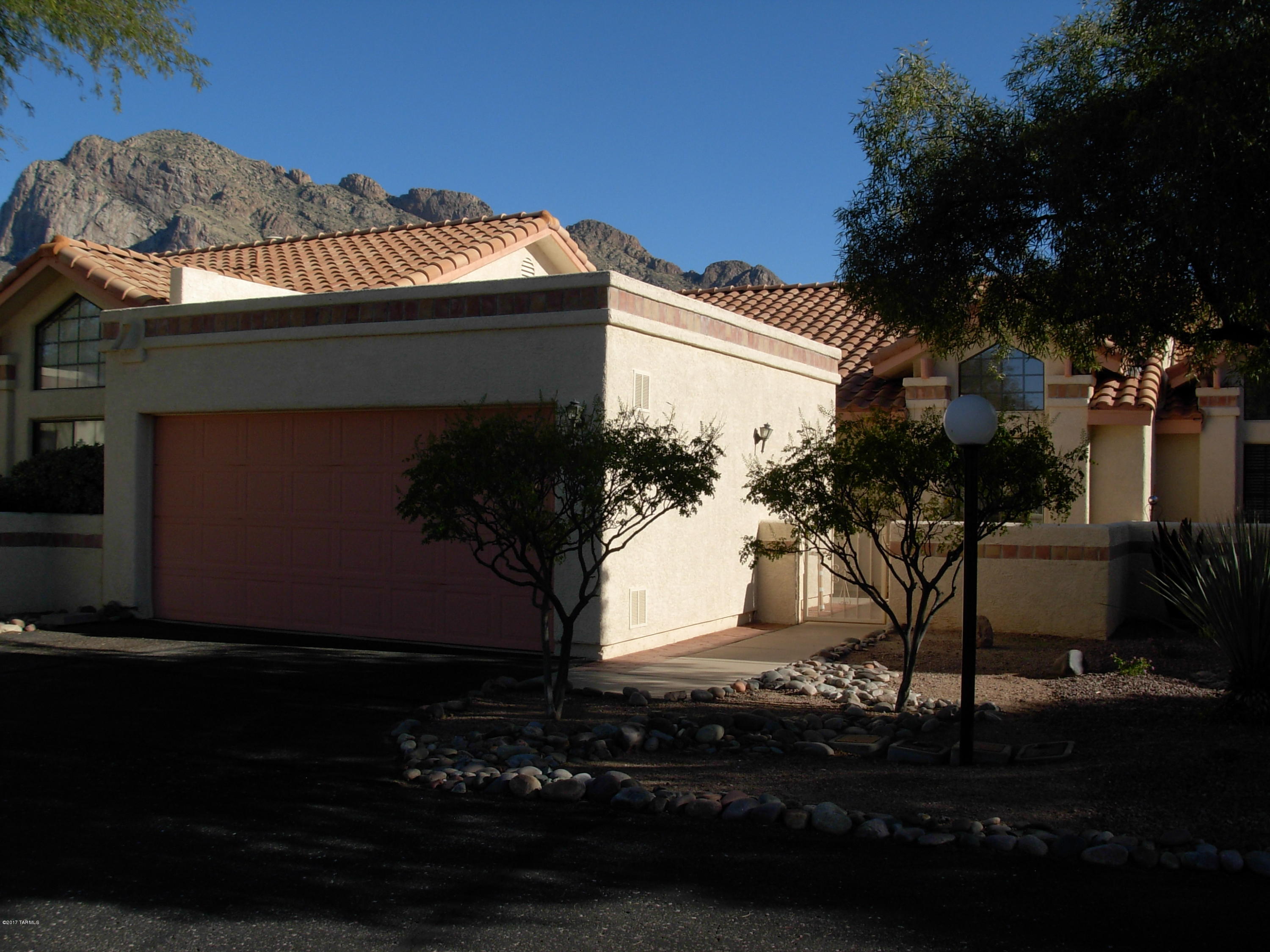 Welcome to near perfection.Lovingly maintained turn key/move in condition home. Freshly painted in warm neutral colors.Ideal Oro Valley location near shopping,dining,golf courses and medical facilities. Large open eat in kitchen with bar opening to great room. Attractive master suite with walk in closet. Second bedroom with soaring ceiling treatment. Bonus nook area ideal for office. Cozy peaceful covered patio next to open natural vegetation area with panoramic Pusch Ridge mountain views. Don't miss this opportunity for affordable comfortable living in a highly desirable Oro Valley community.