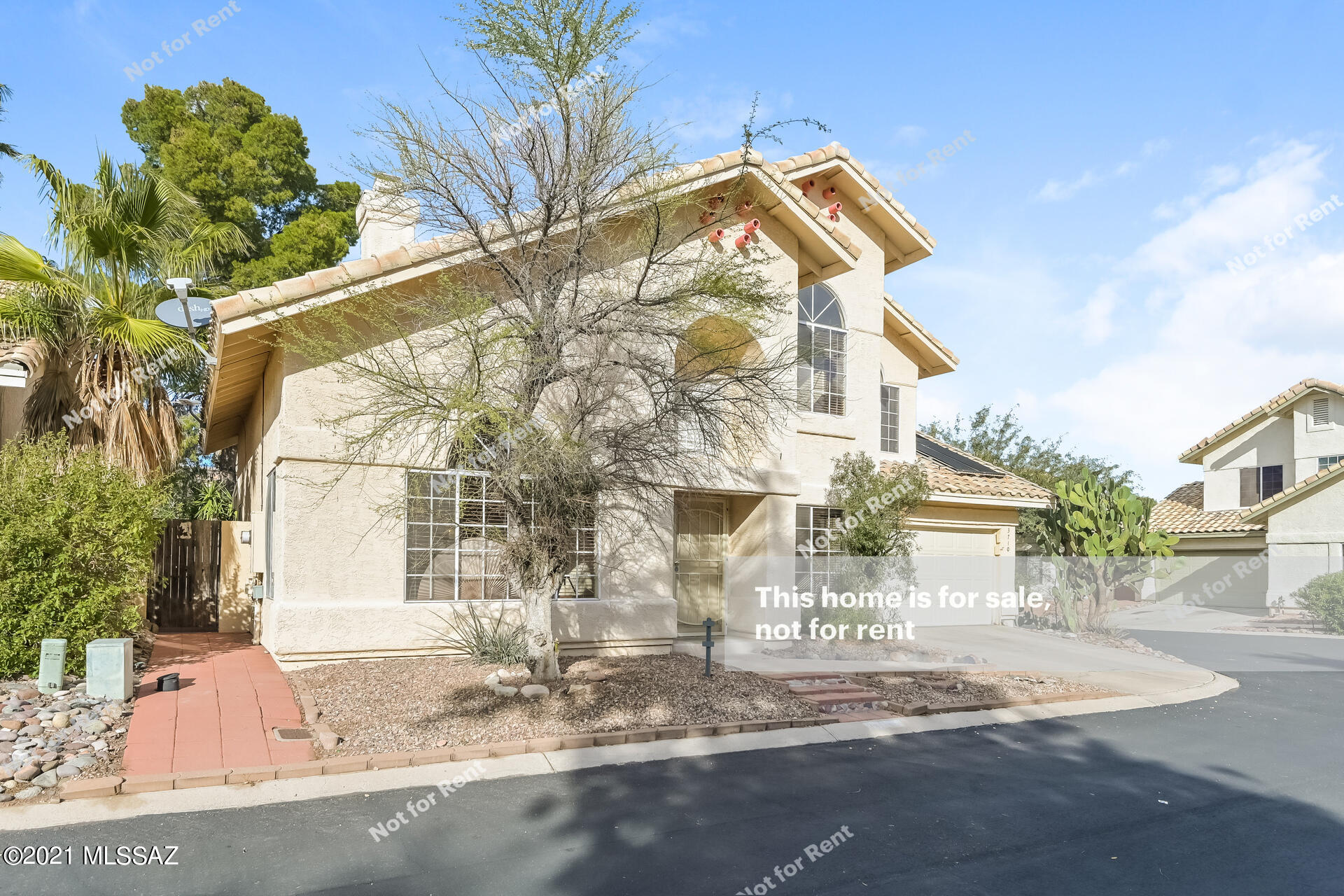This Tucson two-story home offers a patio, and a two-car garage.