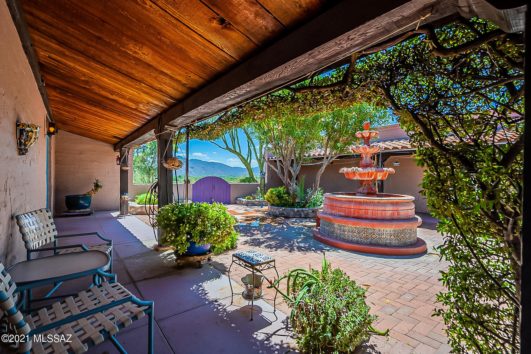 One of a kind Magnificent Hacienda on a Hill, with Panoramic mountain and valley views! Quality Adobe Block Construction. Main Courtyard House, Guest house, Large studio with workshop plus Separate Pool yard with Ramada makes this gated Compound private but close to shopping and dining.  Access to some bedrooms are from lovely center courtyard, not interior hallways. Large grand Living and formal Dining,  Beamed ceilings, large fireplace and concrete floors plus lots of windows with Views, Patios, Fountains and fish Pond. Office with built in book shelves, separate laundry room, loads of storage.  Previously used as a Bed and Breakfast.  Guest House 806 sq ft, one bedroom with lovely patio and Studio Building is Quality built 1492 sq ft., with high ceilings to enjoy the desert views!