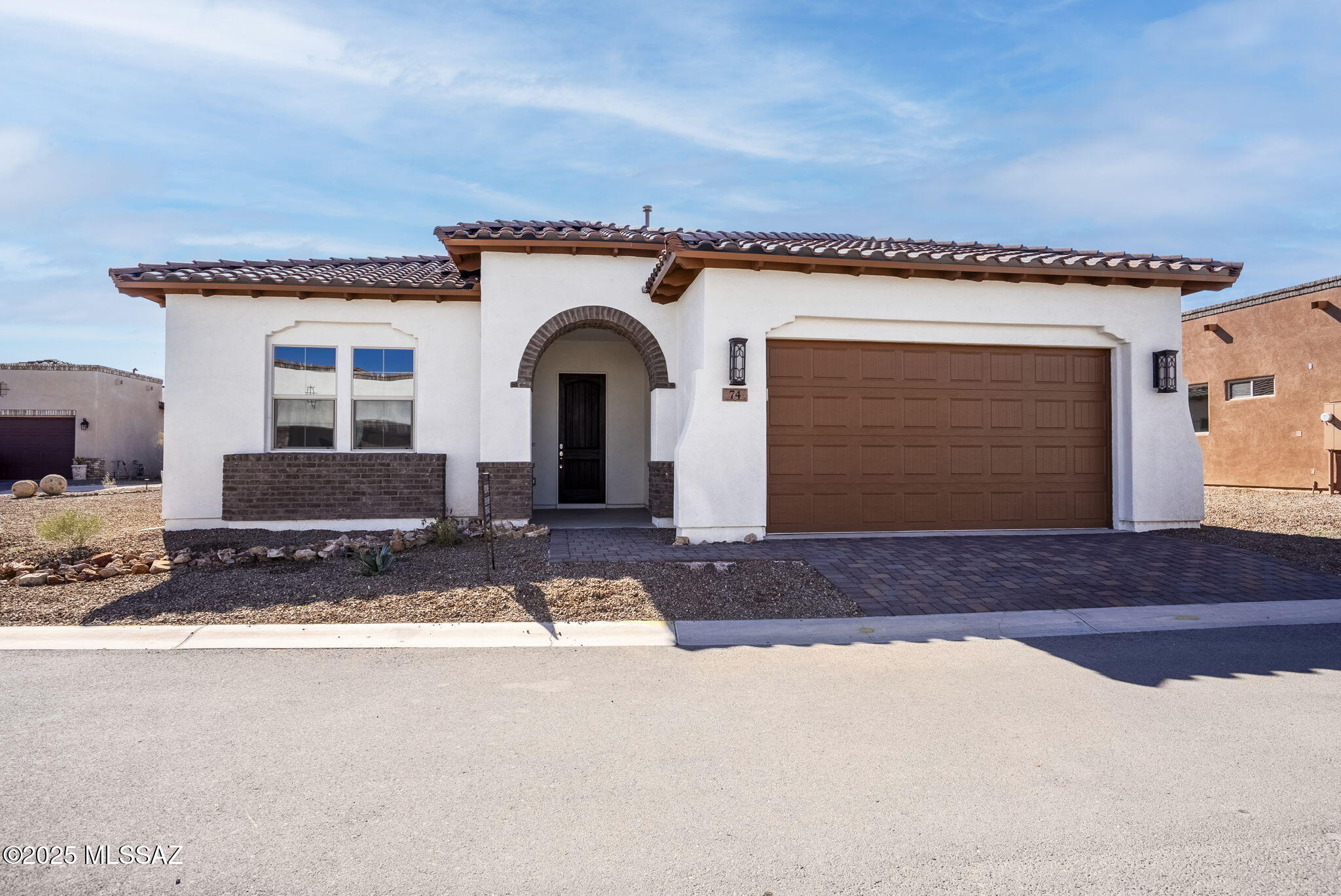 Verbena is an exceptional Evermore new construction home created for elegance and comfort, situated in the breathtaking Tubac Golf Resort community. Thoughtfully crafted, it features two bedrooms, versatile den, and two car garage. Stunning great room is designed for gathering, with cozy fireplace and open-concept layout integrating dining area and chef-inspired kitchen. Serene owner's suite features walk-in closet, spa-like en suite bath with double vanity, and step-in shower. Secondary bedroom is tucked away in a separate wing for added privacy. Flex space is ideal for den, home office, hobby room. Roomy terrace is an ideal spot for taking in the area's natural beauty while entertaining or relaxing. Attached garage offers plenty of space for sheltered parking and storage.