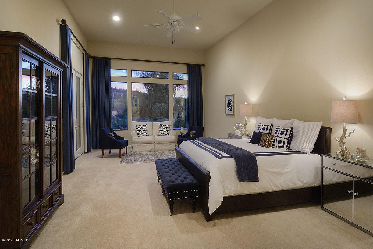 STUNNING FOOTHILLS CONTEMPORARY WITH AMAZING MOUNTAIN & CITY VIEWS! THIS IMMACULATE, NEWER CUSTOM HOME FEATURES A GRACIOUS FOYER ENTRY, DRAMATIC LIVING/DINING RM W/STATELY FIREPLACE & SOARING CEILINGS, SEP FAMILY RM OFF GOURMET KITCHEN, W/LG ISLAND, GRANITE COUNTERTOPS, STAINLESS STEEL APPLIANCES W/GAS STOVE & DBL OVENS, PANTRY & BREAKFAST AREA. 3950 SQ.FT., 4 BR/3 BATH SPLIT BR PLAN, (4TH BR CURRENTLY A STUDY),SPACIOUS MASTER SUITE W/SITTING AREA, 2 WALK-IN CLOSETS, CUSTOM LINEN CABINET, DBL VANITIES, SPA TUB & LG SEPARATE SHOWER.BEAUTIFUL TRAVERTINE AND WOOD FLOORS. AWARD WINNING LANDSCAPE DESIGN W/MULTIPLE PATIOS, TERRACED GROUNDS,GRASSY YARD & DESERT FRIENDLY FLORA ENHANCE THE OUTDOOR LIVING AREAS CAPTURING THE BEAUTIFUL VIEWS! 3 CAR GARAGE, DIST 16 SCHOOLS. FLOOR PLAN & HOA ADDENDUM