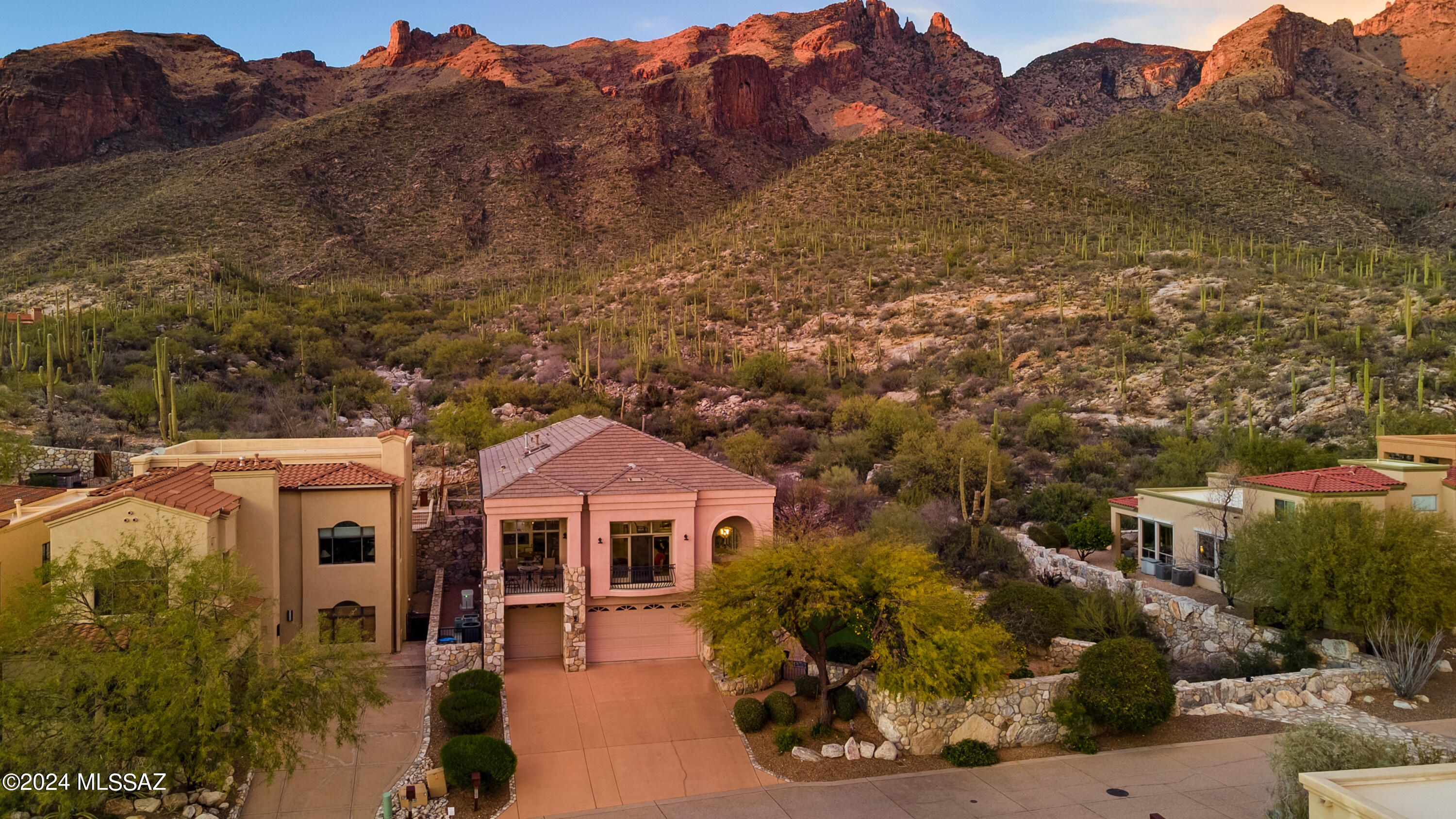 Highly Sought after Catalina Foothills Gated Community, The Summit at Finger Rock. Adjacent to the Breathtaking Coronado National Forest and just Steps away from the renowned Finger Rock Trailhead.  This Soft Contemporary Home 4 bedrooms 3.5 Baths  with Soaring Ceiling height  flanked with Walls of windows that accentuate the never ending views both Mountains and City .
Multiple Balconies allow for relaxing and enjoying the the incredible special space  with so many options to take in the beauty of the natural desert that surrounds you .
The Flexible floor plan creates numerous options for your living enjoyment. The lower level could be a guest quarters with a Master living area or a great place for family gatherings & movie nights. Many recent upgrades and additions to this stunning home.  A few of the recent improvements to the home include a entire home generator to protect you from those intermittent power losses during our beautiful monsoons, 4 sets of Bulldog security doors & screens , 2 New HVAC systems, a major kitchen remodel ,
adding a hot tub in a perfect location to enjoy both city & mountain views to name just a few.
 Please see upgrade list in documents for full list .