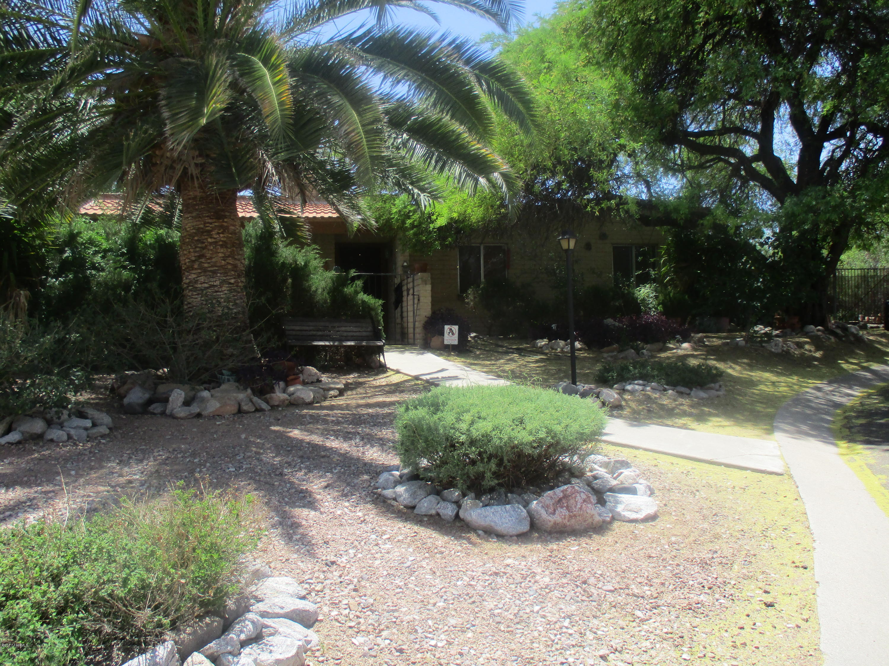 Spacious home, 3 bdrm, Family room, 2 bathrooms with many upgrades ready to move in. Family room has it's own private outside patio and a large rock fireplace. Upgraded kitchen with plenty of work area for those evening meals and entertaining. Separate laundry room off of the kitchen. Large lot with lush landscaping and large deep diving pool and heated jacuzzi for those summer or winter days and nights. Full length covered rear patio next to gated pool for entertaining and family gatherings Large 15X15 wood storage building for storage, Home freshly painted with
lots of shaded areas for outdoor fun. Large two car garage and space on the west side of home for motor home storage that is gated and easily accessible. Within walking distance to  Udall Park, Churches, medical/dental & shopping