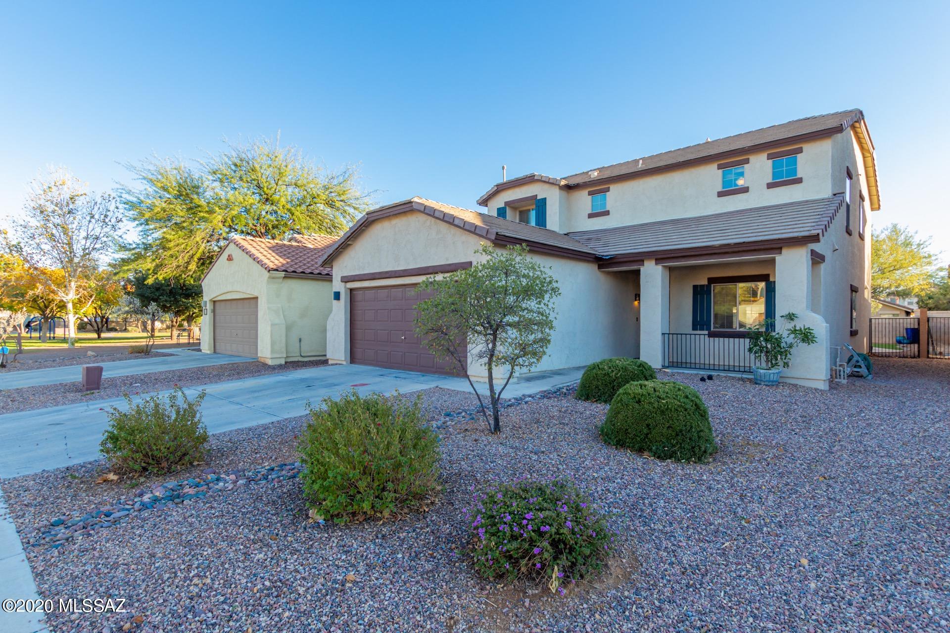 Lovely move in ready home in the Rancho Sahuarita community. Tall ceilings, beautiful tile floors, warm palette, & window blinds. Formal living/dining room & spacious family room for entertaining.  The eat-in kitchen features a center island, handsome counters,  & plethora of wood cabinets. French doors to patio from breakfast area. Amazing loft area with endless possibilities. Generous size bedrooms, plush carpet, ample closets, ceiling fans, & interior laundry room. the private master retreat boasts a walk in closet, large en suite bath & dual sinks.  Meticulous backyard setting is perfect for outdoor entertaining. Natural gas for a BBA & the fire pit area, sparkling pool w/waterfalls, covered paver patio, & synthetic turf.  Enjoy all the amenities Rancho Sahuarita has to offer!