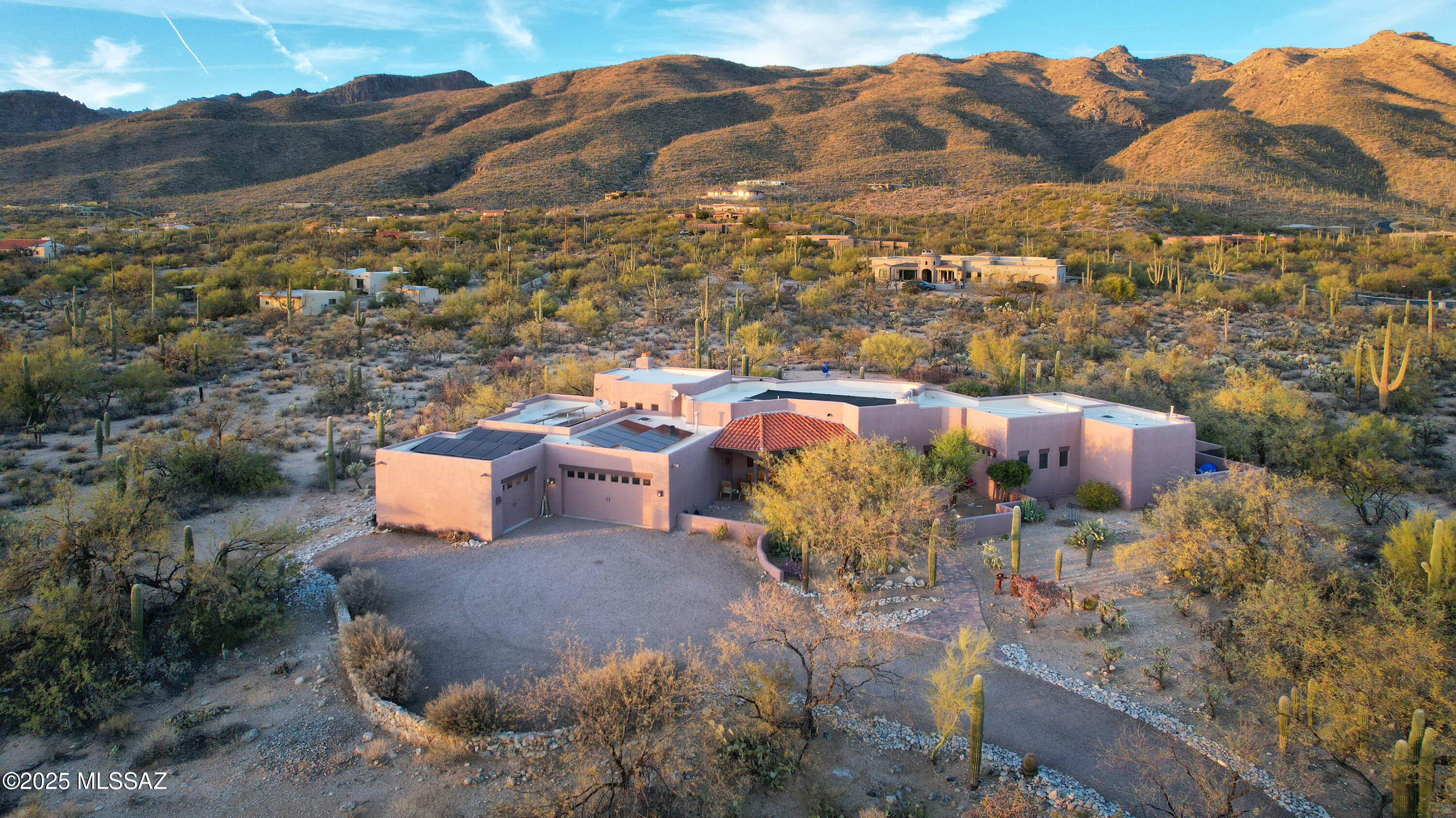 Nestled in the exclusive Fetzer Ranch/Saguaro Hills Estates, this exceptional home sits on 3.32 acres of Saguaro-studded desert landscape. Enjoy breathtaking views of the Catalina & Rincon Mountains from your private oasis, featuring a sparkling pool, spa w/waterfall, & natural gas fire pit. Inside, a 3,022 sq ft Santa Fe-style home boasts Viga beamed ceilings, a spacious family room w/Kiva fireplace, and a gourmet kitchen w/granite countertops. The luxurious primary suite offers a seamless glass corner window, a jetted tub w/views, and a private patio. 3 Bedrooms, 2-1/2 Bathrooms, split bedroom plan, plus separate office awaits. Owned solar for efficiency & 3-car garage too. Just minutes from dining, shopping, golf, & Mt. Lemmon, this home is the perfect blend of luxury and convenience. THE PROPERTY
"	Prestigious Fetzer Ranch/Saguaro Hills Estates Gated Community
"	3.32 Saguaro-Studded Acres
"	Private Setting but only Minutes to Shopping, Restaurants, Parks & Hiking/Biking Trails
"	Just Down the Street from Arizona National Golf Course
"	At the Base of Mt Lemmon for Easy Access to this Local Favorite Getaway
"	Views, Views, Views
"	North-facing Backyard Oasis with Stunning Views of the Catalina Mountains
"	Inviting Entry Courtyard with Fantastic Rincon Mountain Views 
"	Custom Designed Courtyard Entry Gate 
"	Sparkling Pool & Spa with Waterfall - Just Refinished with Pebble Tec & New Tile 
"	Outdoor Natural Gas Fire Pit
"	Low Voltage Landscape Lighting System
"	6-Zone Automatic Drip Irrigation System
"	Fully Owned 7kW Active Solar Electric System - 28 Panels
"	Whole-House Monitored Security Alarm System
"	2-Car Attached Garage Plus a 1-Car Attached Garage that has a 240v Outlet for Running Equipment or Charging Your EV
"	Heated & Cooled Workshop/Storage Room Adjoining the Garages

HOUSE
"	3,022 Square Feet of Living Area Plus 3-Car Garage and Workshop
"	Formal Living & Dining Rooms, Plus Family Room with Cozy Fireplace
"	3 Bedrooms, 2-1/2 Baths
"	Separate Office
"	Split Bedroom Floor Plan
"	Santa Fe Style - Beautiful Viga Beamed Ceilings & Heavy Viga Columns with Corbels in the Main Living Areas
"	Mexican Saltillo Tile Flooring in Living Areas and Carpet in Bedrooms
"	Almost Floor-to-Ceiling Windows Brighten the Interior & Provide Panoramic Views
"	Perfectly Placed Clerestory Windows Throughout, Capture Additional Stunning Views from Every Angle and Add Lots of Natural Light
"	Gas Beehive Fireplace in Family Room
"	Wet Bar in Living Room
"	Freshly Painted Interior 
"	Water Softener 



KITCHEN
"	Bright & Open with Amazing Views of the Catalina Mountains
"	Casual Dining Nook
"	Expansive Island with Bar Seating and Prep Sink
"	Granite Countertops
"	Gas Cooktop
"	Double Ovens 
"	Walk-in Pantry
"	Reverse Osmosis System
"	Stainless Steel Appliances

PRIMARY BEDROOM SUITE
"	Seamless Glass Corner Window Creates an Invisible Wall to the Exterior
"	Private Covered Patio
"	Large Walk-in Closet
"	Travertine Tile in Bath
"	Double Sink Vanity
"	Walk-in Shower
"	Jetted Tub with Fabulous View

BACKYARD
"	2 Covered Back Patios off the Family Room and the Primary Bedroom Suite
"	Both Pool & Spa Completely Resurfaced with Pebble Tec Finish and New Tile
"	New Electric Pool/Spa Heat Pump (2024)
"	Passive Solar Blanket Installed on Roof to Supplement Heat for Pool/Spa
"	New Pool Pump (2023)
"	New Filter with Glass Media (2021)
"	Natural Gas Fire Pit
"	Gas Stubbed for BBQ Grill