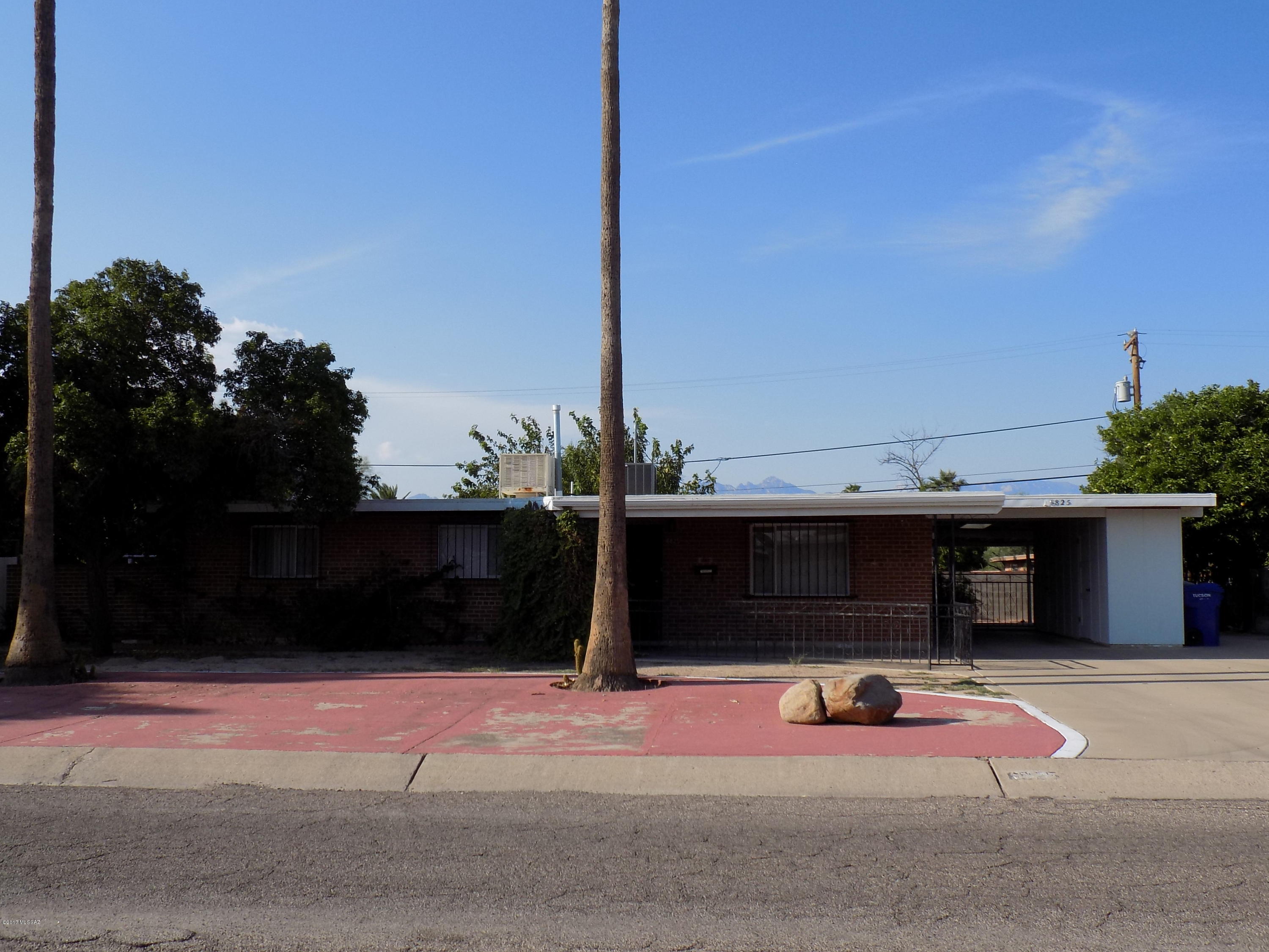 Charming wire-cut brick home - solid construction. 3BR/2BA, living room, dining room, single carport with bonus side parking for possbile RV, separate workshop/storage, full length covered patio. Dual cooling, but evap hasn't been used in years. Original 50's tiled bathrooms! Original owner!