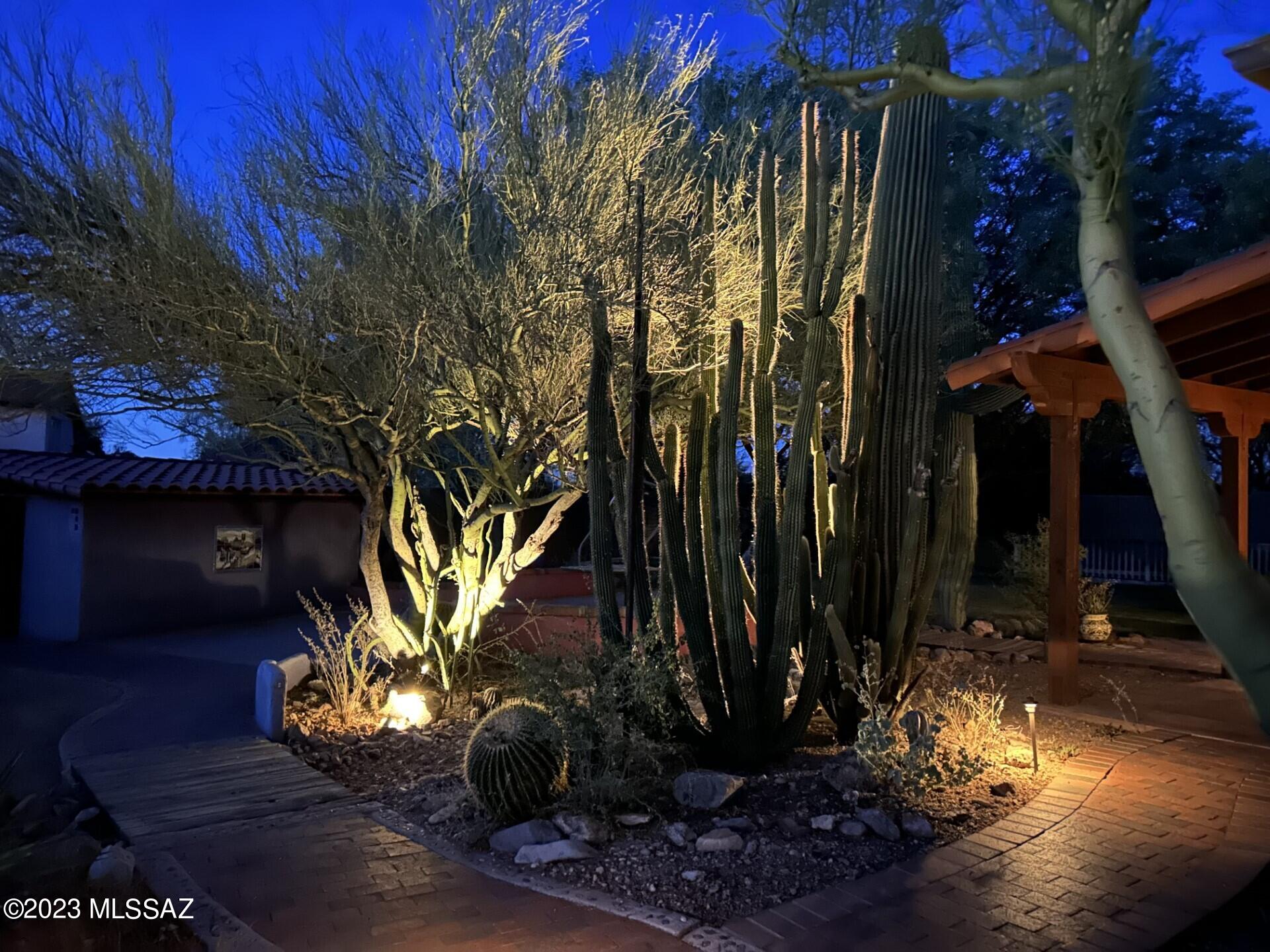 This home has it all. 5 beds + 4 baths on an acre with no HOA. The lush yards with desert landscaping, a nature trail, sparkling heated pool and spa also boasts a basketball court, a rooftop deck, fruit trees, a built in BBQ all with multiple covered patios and a charming front courtyard. As you enter the home into the large great room that opens to the dining area and kitchen, with beehive fireplace, you find a split floor plan with a large bonus room. Multiple exterior entrances allow for perfect options for a mother in law suite or private guest quarters. The exposed beams, high ceilings, and ample skylights and windows make for a light and bright home. This home has been lovingly maintained. Lease Solar. Don't miss this one!