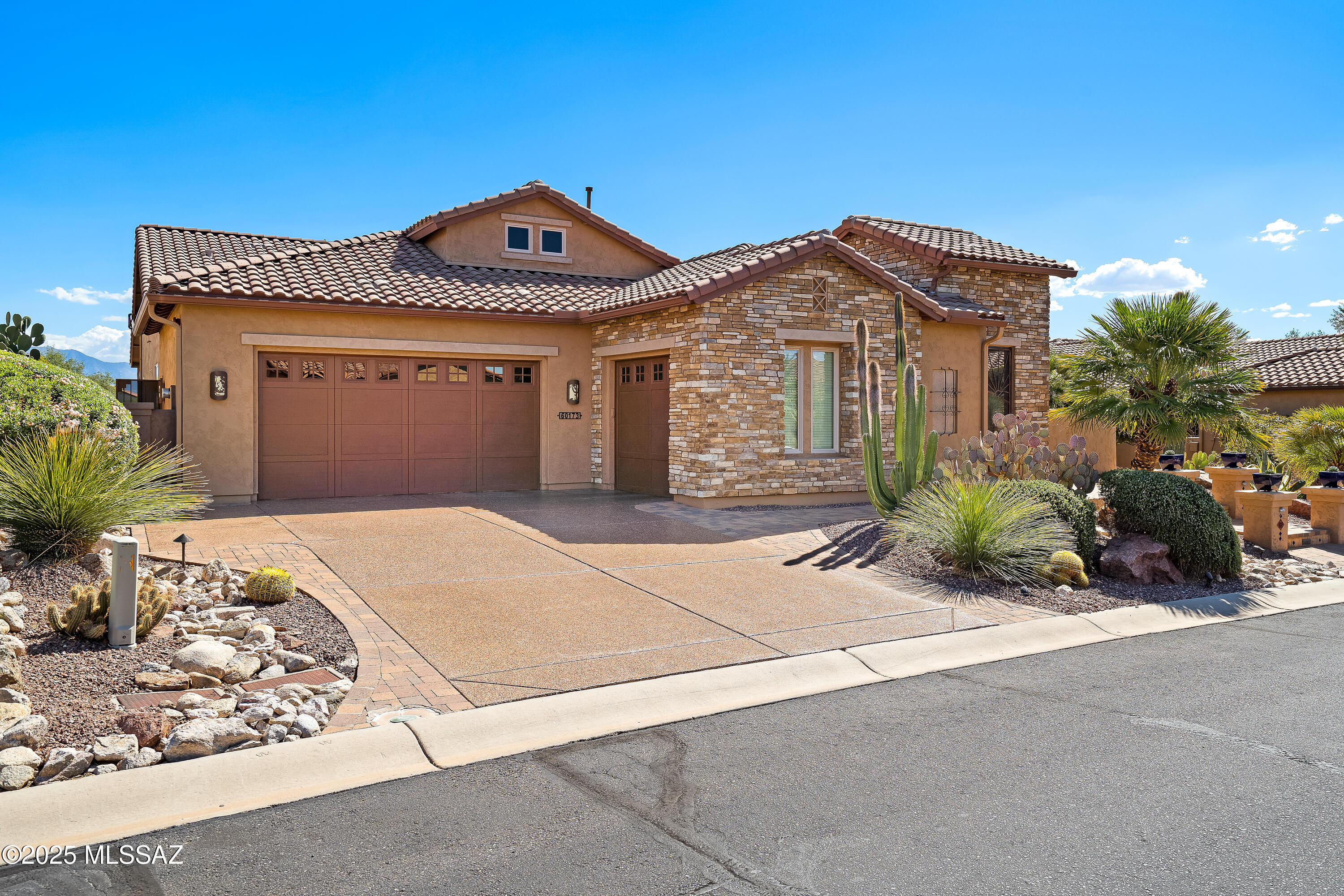 Rare & Highly Sought-After Luxury Montera Floor Plan with Unmatched Views and Resort-Style Living. Experience the perfect balance of luxury, functionality, and desert serenity in this exceptional home, thoughtfully designed for both intimate everyday living and grand-scale entertaining. Nestled on a premium lot overlooking the 12th hole of a scenic golf course with breathtaking views of the Santa Catalina Mountains, this rare model offers a lifestyle of comfort, elegance, and privacy. Step into the expansive great room featuring a cozy gas fireplace and a seamless connection to the chef's kitchen, fully equipped with high-end appliances, a 5-burner gas cooktop, a spacious island, Butler's Pantry, and a large walk-in pantry. The adjacent dedicated dining area and Morning Room provide versatile space for entertaining or relaxing  perfect for your morning coffee, evening drink, or casual media lounge. Step outside to the covered paver patio complete with roller shades and a TV, and immerse yourself in the resort-style backyard. Enjoy your private glistening pool and spa, all set against the stunning backdrop of desert, golf course, and mountain views  your very own Southern Arizona sanctuary. Inside, the home features three full bedrooms plus a spacious den, along with an attached Arizona Room that perfectly blends indoor comfort with outdoor charm. The Primary Suite is a true retreat, offering panoramic views of the pool and surrounding landscape with its own access door to the backyard. Enjoy a spa-like bathroom with dual vanities, a soaker tub, an oversized walk-in shower, and a custom walk-in closet with built-ins. The split-bedroom floor plan ensures maximum privacy for you and your guests. Additional highlights include Generous laundry room with sink and storage, oversized 3-car garage with space for vehicles, golf carts, and hobbies, and premium upgrades throughout, enhancing the home's style and convenience. This exceptional home was designed for effortless desert living and offers a rare opportunity in a highly desirable location. Don't miss your chance to make it yours  this one won't last long.