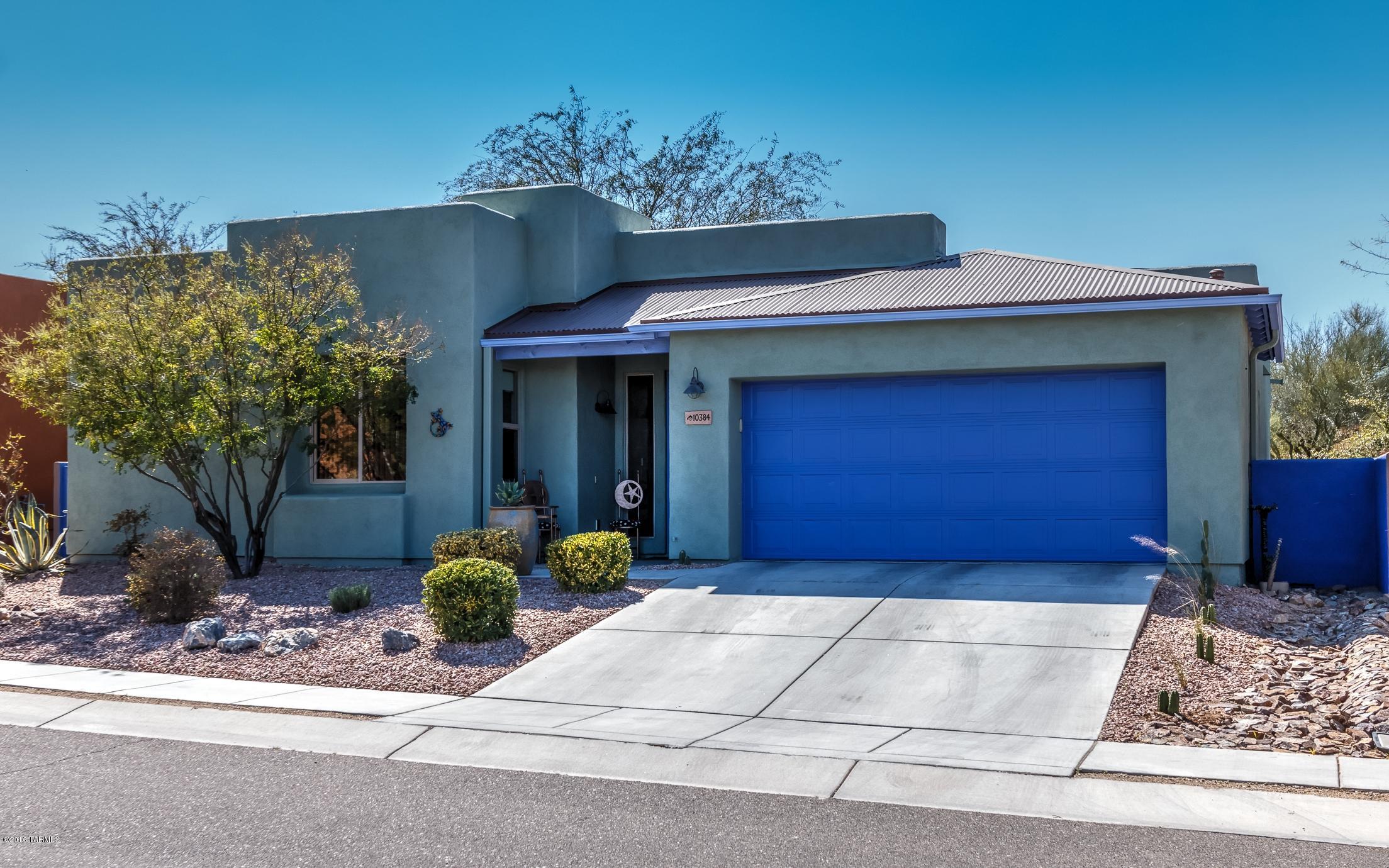 Beautiful, exceptionally well-maintained home in Civano! 4 bedrooms, 3 bathrooms, 2192 Sq. Ft. 20'' tile flooring throughout. Kitchen features granite counter tops w/large farm sink and commercial faucet. Custom interior and fresh exterior paint. Dual sink executive height vanity in the M. Bathroom. Large walk-in closet in M. Bedroom and lots of storage throughout the home. Tile shower and tub surrounds in all bathrooms. Ceiling fans in all rooms. Laundry Rm. incl. double utility sink. Garage has built in storage cabinets and overhead storage rack. Back covered porch features extensive hardscaping for outdoor living. Raised beds planted w/roses along the patio walls and the backyard has kumquat, Arizona sweet, blood orange and meyer lemon trees. This home shows extremely well, you must see