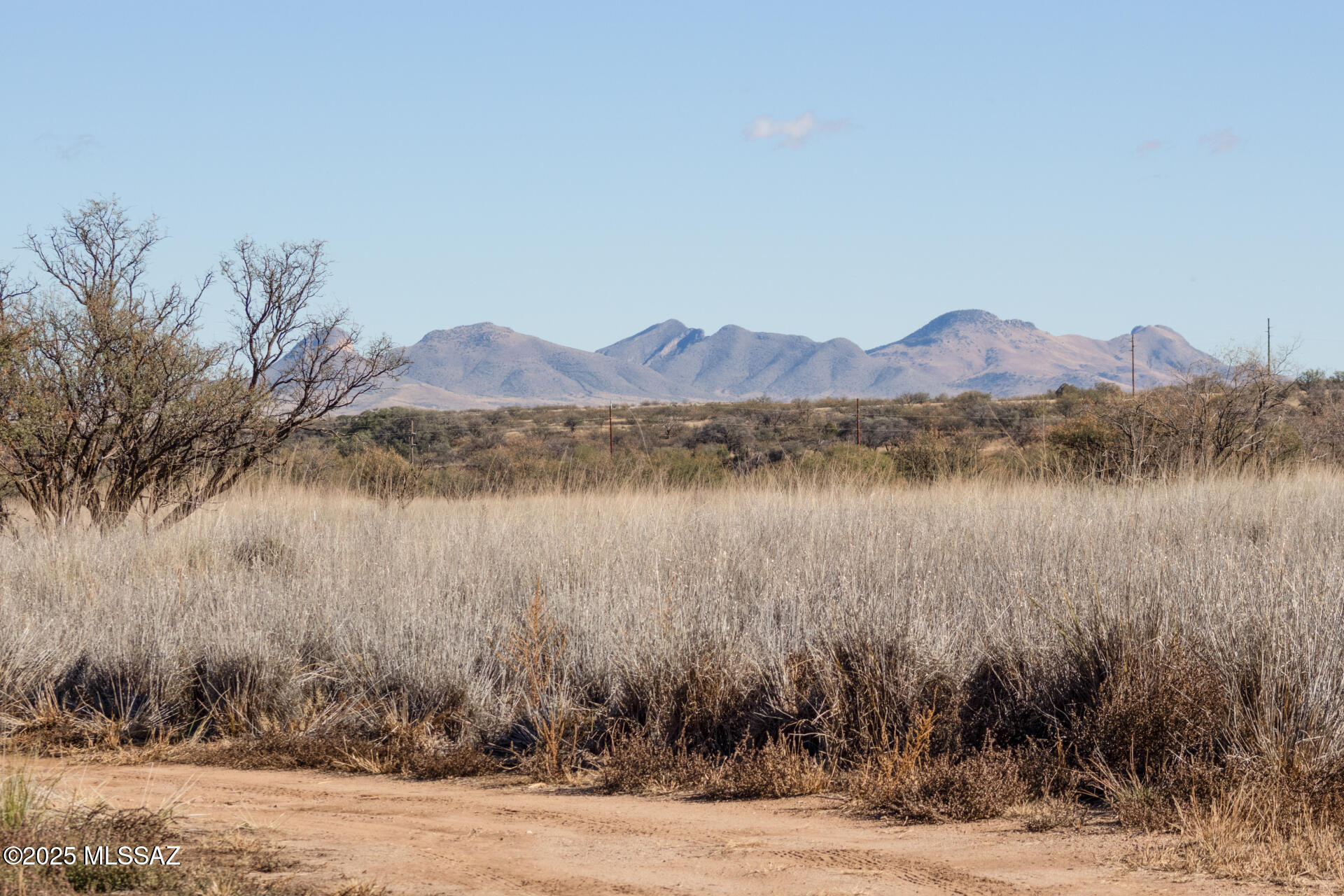 Discover endless possibilities on this fenced 4.4-acre parcel in Gardner Canyon, surrounded by sweeping views and the rolling hills of the Santa Rita mountains. Horse-friendly and offering multiple ideal building sites, this property sits at nearly 5,000 ft elevation offering cooler temps and a great escape from the city. This parcel is fully prepared for your vision with 200-amp power, a private well and well house, an installed septic system, and a convenient on-site shed. Enjoy peaceful seclusion just 45 minutes from downtown Tucson and 10 minutes from Sonoita Arizona, the heart of Arizona's original and largest American Viticultural Area (AVA), renowned for its unique high-altitude vineyards and award-winning wines. Your perfect blend of privacy, nature, and accessibility. Tour today!