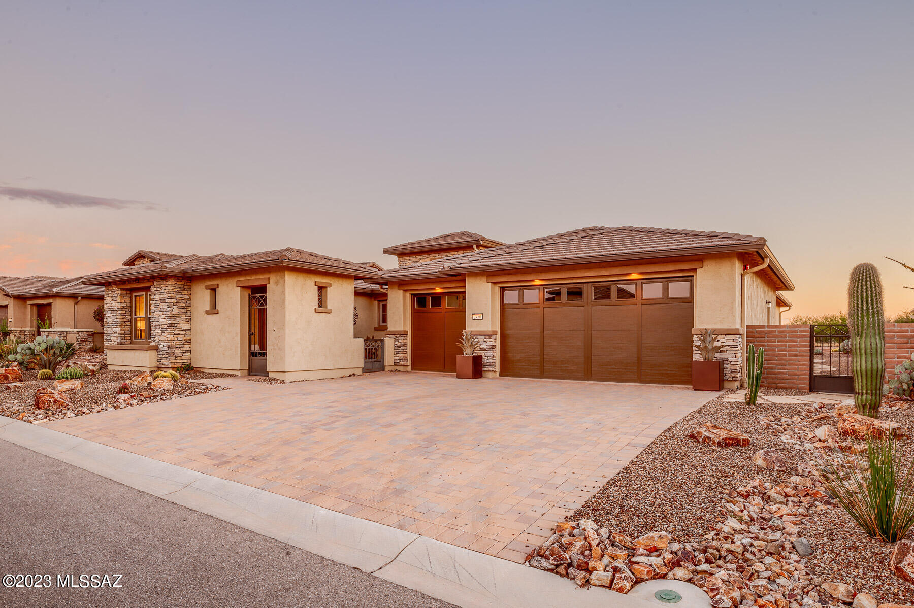 Extraordinary Tesoro offering. From the driveway pavers, exterior D upgrade to the two wrought iron entry gates, courtyard & the casita you will notice every detail and upgrade as it was meticulously designed. This masterpiece, offers group 6 cabinets throughout, upgraded quarts throughout, extended kitchen, dining room, primary bdrm, den & garage. Wet & dry bar, valet, 2 fireplaces, waterfall grand island, extra roll out trays in kitchen cabs. Upgraded tile backsplash throughout every bathrm, upgraded lightening throughout, walk-in shower w/rain shower head. Fabulous stand alone soaking tub. Upgraded Blanko and Kohler sinks throughout. Upgraded to maximum levels inside and out. Electronic ramada, electronic shades & remote controlled fans. Situated on a rare N/S facing private view lot