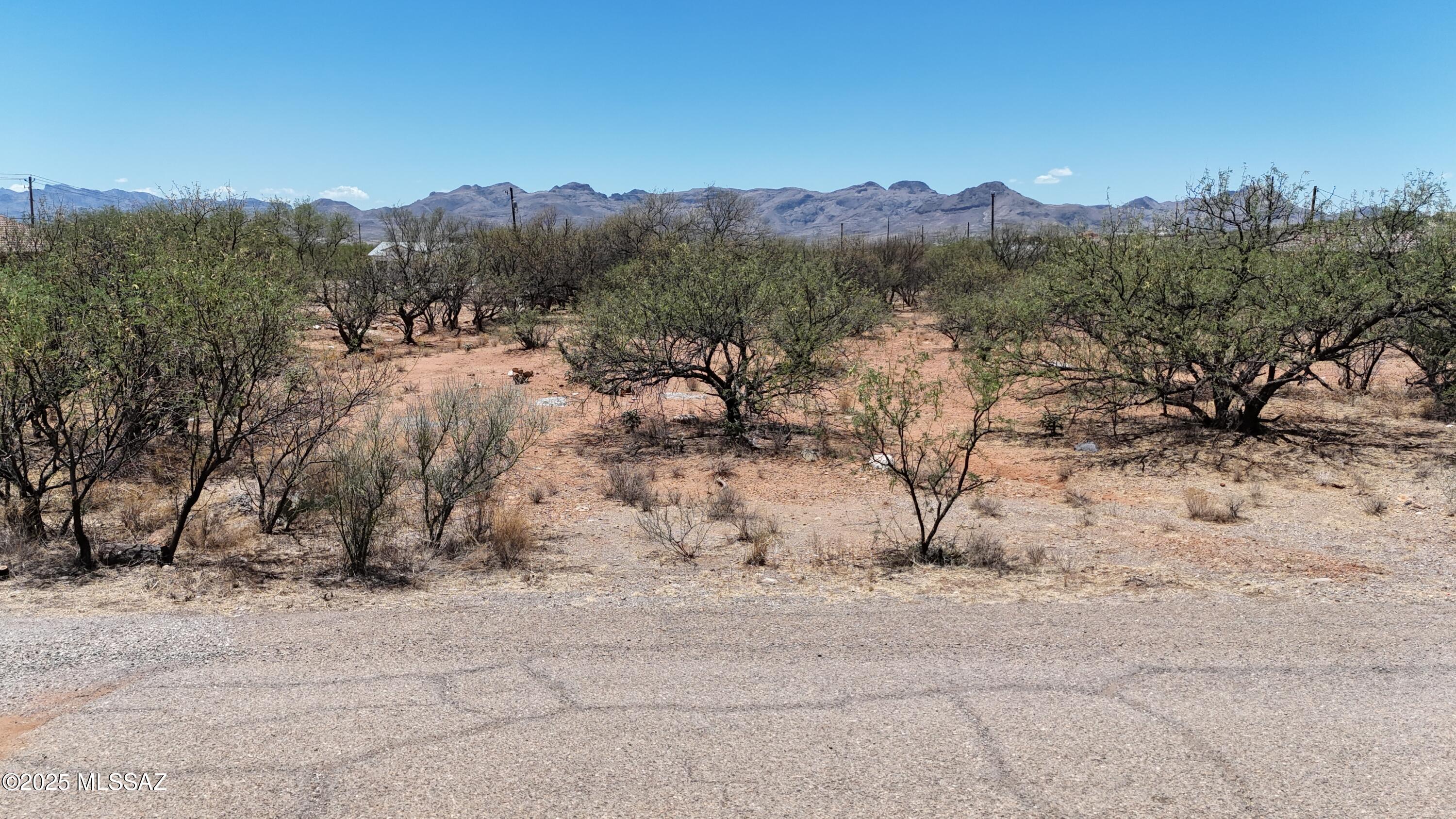 Villas 12 lot with Electric, water and Sewer at the street.  The lot is flat and easy to build on.  All paved access.  Mountain views.