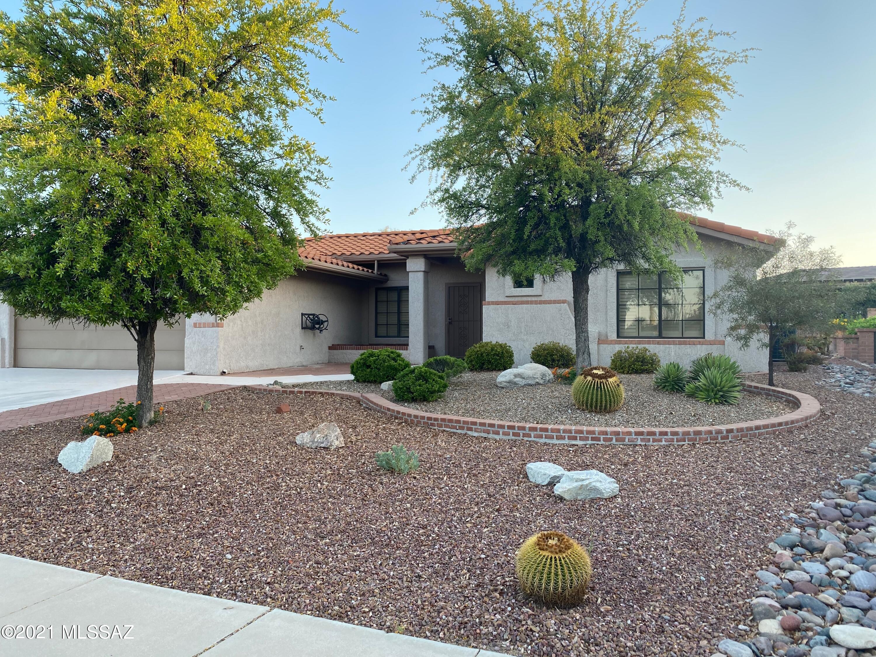 Welcome to the Sun City lifestyle.  Wonderful light & airy home with great floor plan & nice architectural detail.  Home boasts bright kitchen with tons of counter & cabinet space and fun breakfast nook surrounded by bay windows.  Home also features gorgeous wood plantation shutters throughout, lighted ceiling fans & updated lighting & fixtures in bathrooms.  The large master bedroom has private master bath, large closet, lighted ceiling fans and beautiful bay windows overlooking north facing rear yard.  Guest room easily converts to home office with built in wall bed, shelves and drawers.  North facing Arizona room opens to beautiful professionally landscaped yard with great patio and seating area.  Additional extra room off garage is perfect for crafts and hobbies.  Don't miss this one.