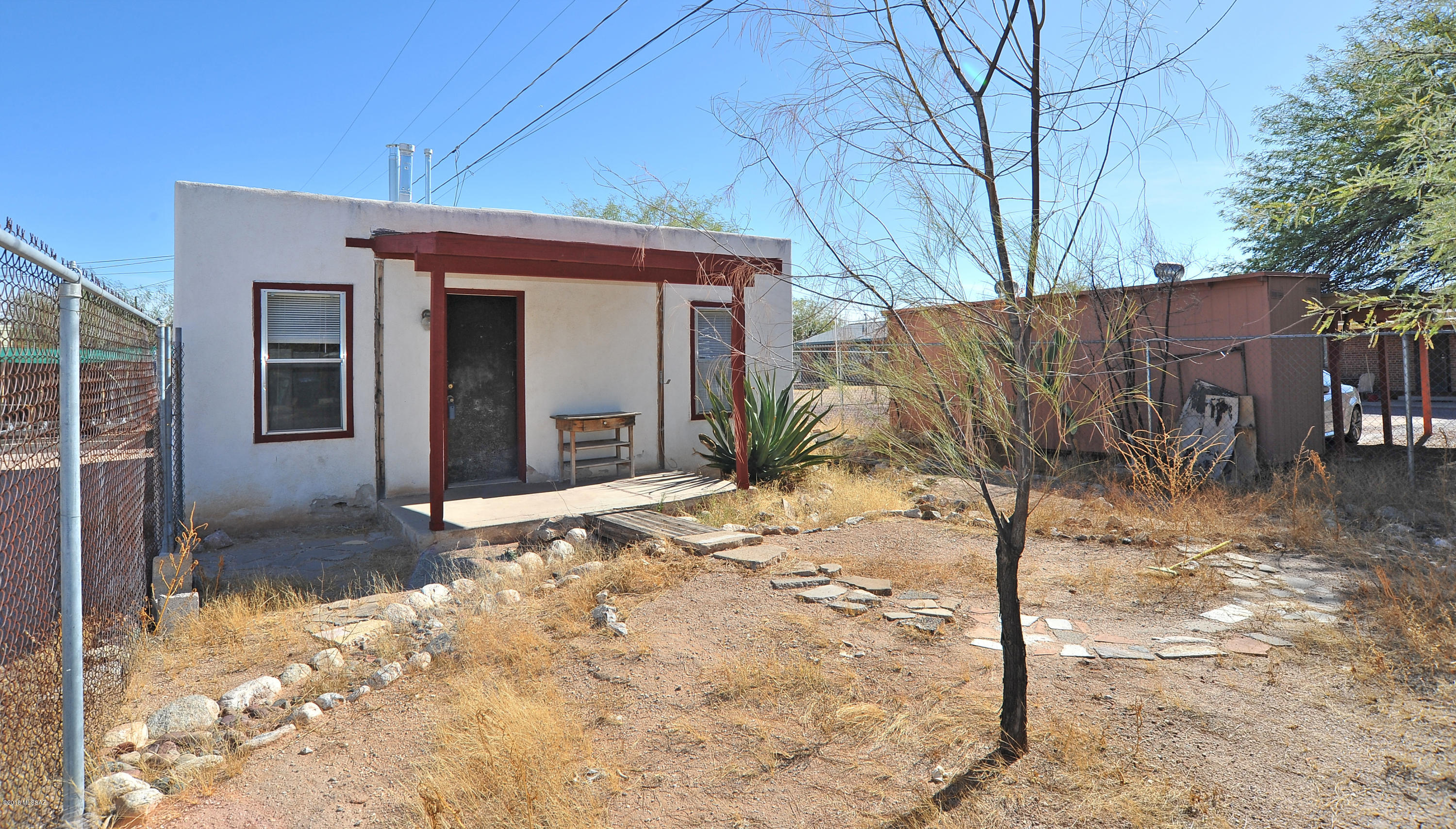 Remarkable value for this property that is a home with a guest home in back, just a few blocks from the University of Arizona. Very popular location, close to everything. The guest home can be rented out for extra income by the owner making this a great investment property. Have your student live in one home and rent out the other. Many possibilities