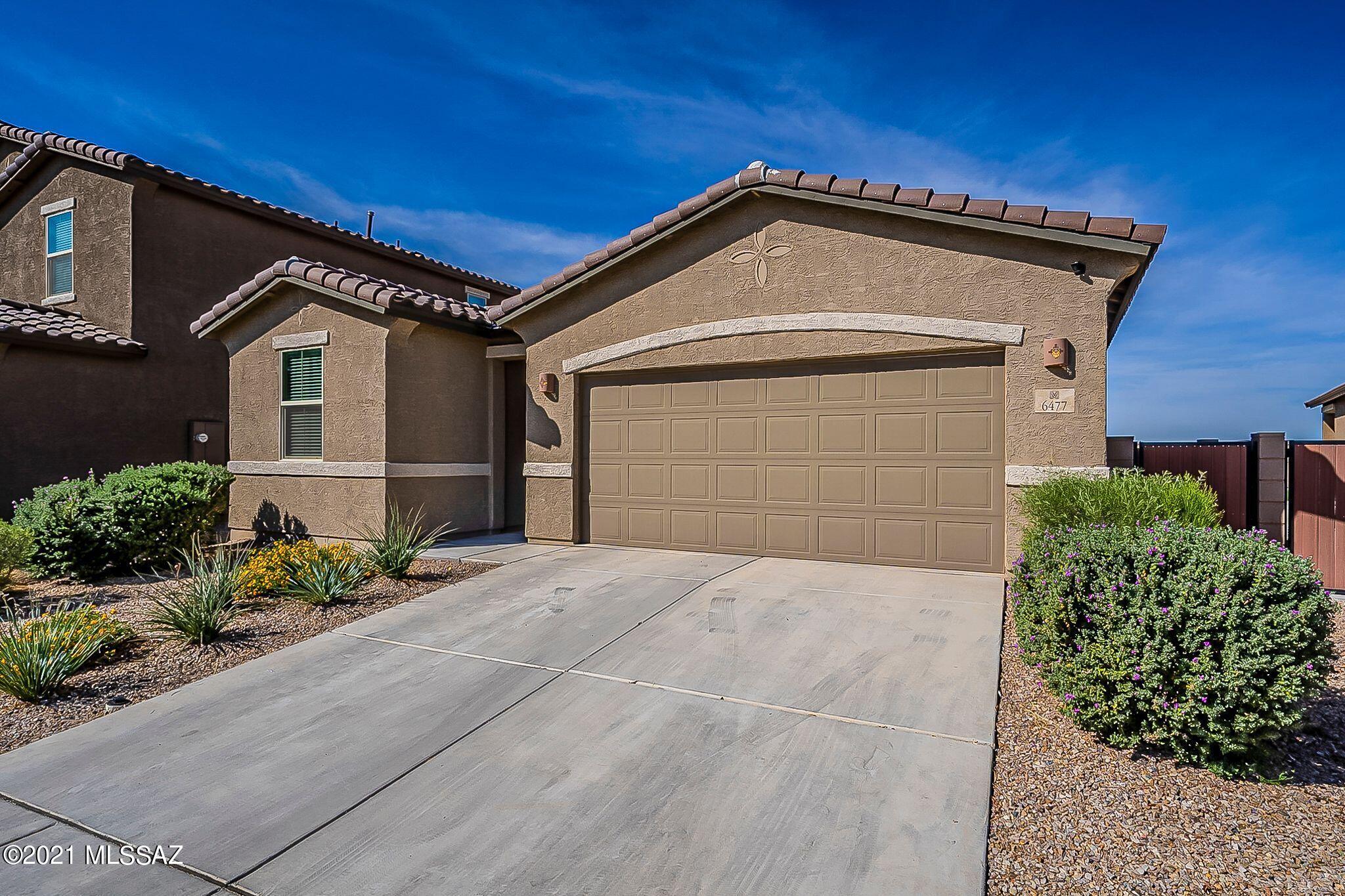 Wait Honey! Stop the car! Your new ranch-style Peridot plan offers an inviting warm kitchen with a granite center island and countertops, walk-in pantry and breakfast nook overlooking a spacious great room with an adjacent covered patio. Vail School District and no neighbors behind. Three generous bedrooms, plus a den. This lovely home offers a beautiful split floor plan owner's suite with a private bath, quartz countertops in both bathroom, oversized walk-in closet, offer plenty of space for rest and relaxation. Other notable features include a central laundry room and a 2-car garage. This home also includes ceiling fans throughout, water softener, reverse osmosis, and faux wood white blinds! Call for your private showing today!