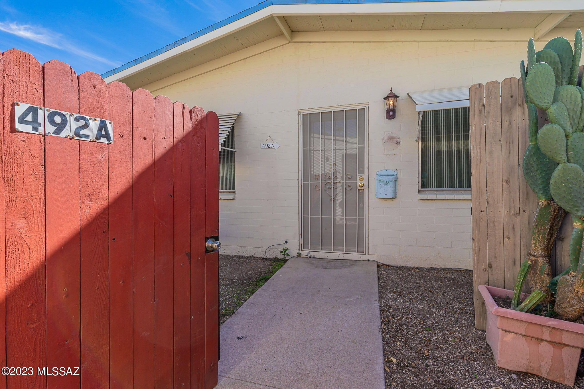 A highly desirable 55+ community! This beautiful end unit features enclosed patio for privacy, tile throughout, small Arizona room, lovely yard and lots of character. Community features pool and clubhouse. Roof and exterior paint maintenance by the HOA. Close to St. Mary's Hospital, shopping and entertainment. Storage room and laundry room directly in front of unit. Furniture to be included in sale.
