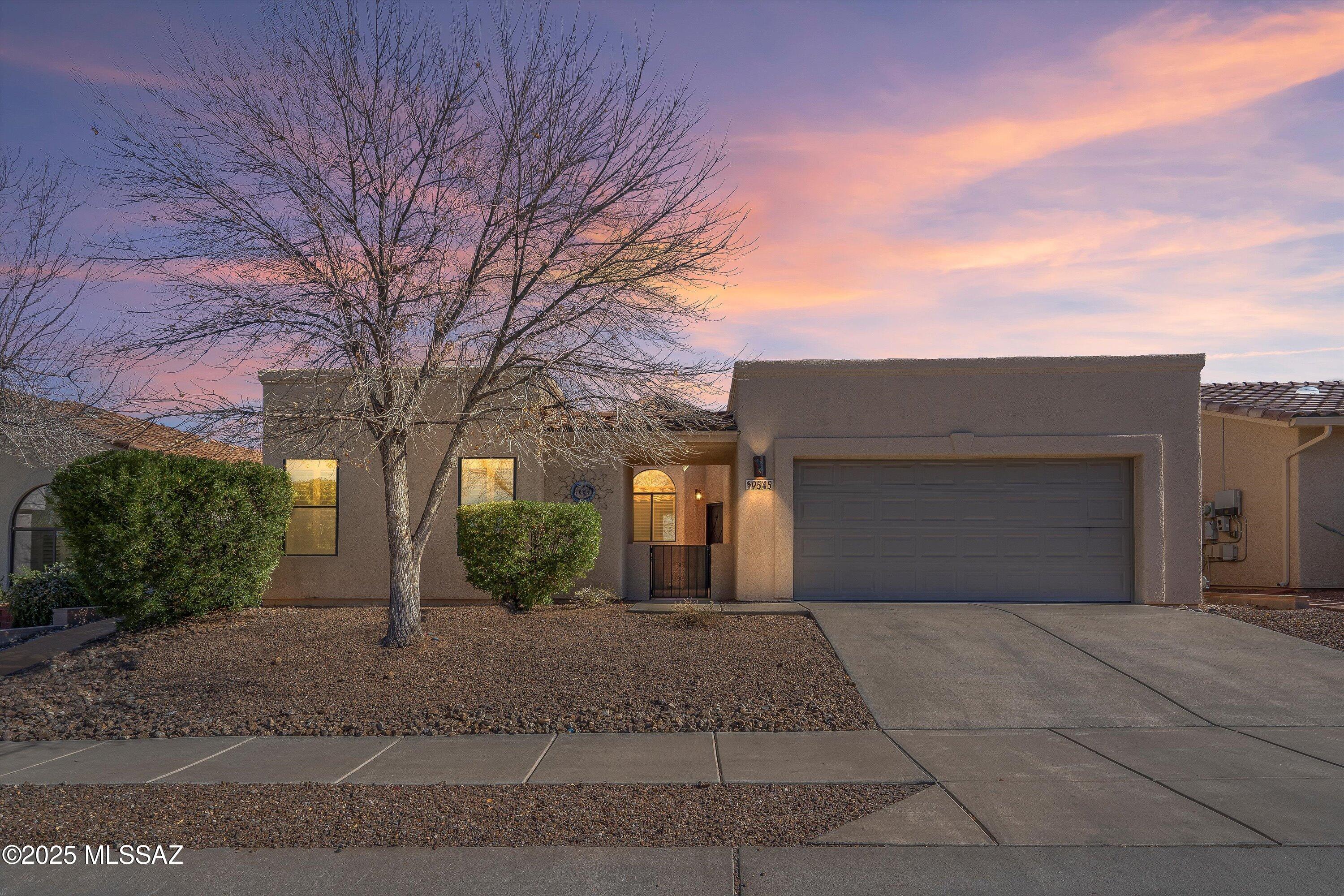 This home on Tucson's desirable East Side is located in a small, quiet subdivision of just 34 homes built by Chirco Homes. The 1580 sq. ft. main house features 3 bedrooms, 2 bathrooms, a spacious formal dining room, a laundry room with pantry/storage, vaulted ceilings and ADA-compliant features including wide doorways and roll-in showers for wheelchair accessibility. The 156 sq. ft. guest quarters, with separate entry and a full bath, could also make a great office, hobby room, or workout space. Ornate security doors, plantation shutters, and a low-maintenance backyard with a large covered porch and raised planters complete this lovely property.