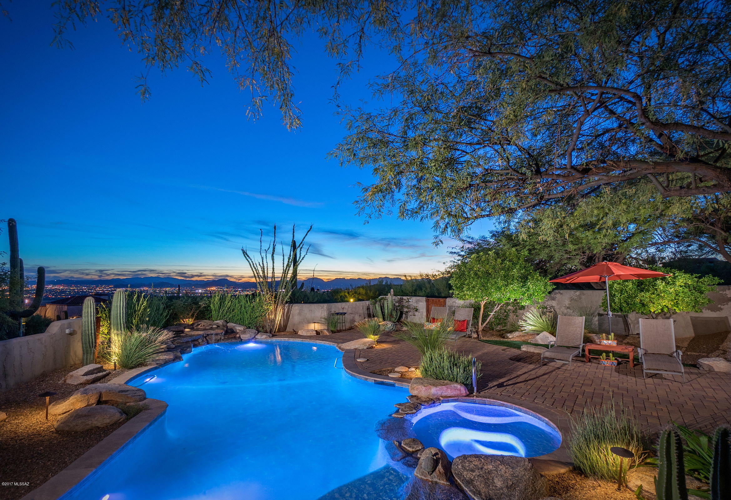 THIS EXQUISITE CUSTOM HOME, LOCATED IN THE HIGHLY SOUGHT AFTER COBBLESTONE GUARD GATED COMMUNITY, IS SITUATED ON A PREMIUM VIEW LOT W/ UNPARALLELED CITY & MTN VIEWS. THIS SPACIOUS OPEN GREATROOM CONCEPT, POWERED BY 68 SOLAR PANELS, IS COMPRISED OF 4 BDRMS & 4 BA'S W/ 3 FRPLS. COMPLETELY REBUILT FROM FLOOR TO CEILING IN 2011, ATTENTION TO DETAIL IS EVIDENT IN THE EXTENSIVE LIST OF CUSTOM DESIGNED FEATURES, INCLUDE NEW DOORS & WINDOWS, TONGUE & GROOVE CEILINGS, LIMESTONE & TRAVERTINE FLOORING. THE CHEF’S KITCHEN FEATURES VIKING 6 BURNER COOK TOP, DOUBLE OVENS, SUBZERO FRIG.  A SUCCESSION OF CRTYRDS RESULT IN A JUXTAPOSITION OF PRIVATE & SOCIAL SPACES, OFFERING DIFFERENT ELEMENTS SUCH AS RESORT LIKE POOL/SPA, BBQ AREA & CAREFULLY PLACED VEGETATION, BLENDING SEAMLESSLY WITHIN IT'S ENVIRONMEN