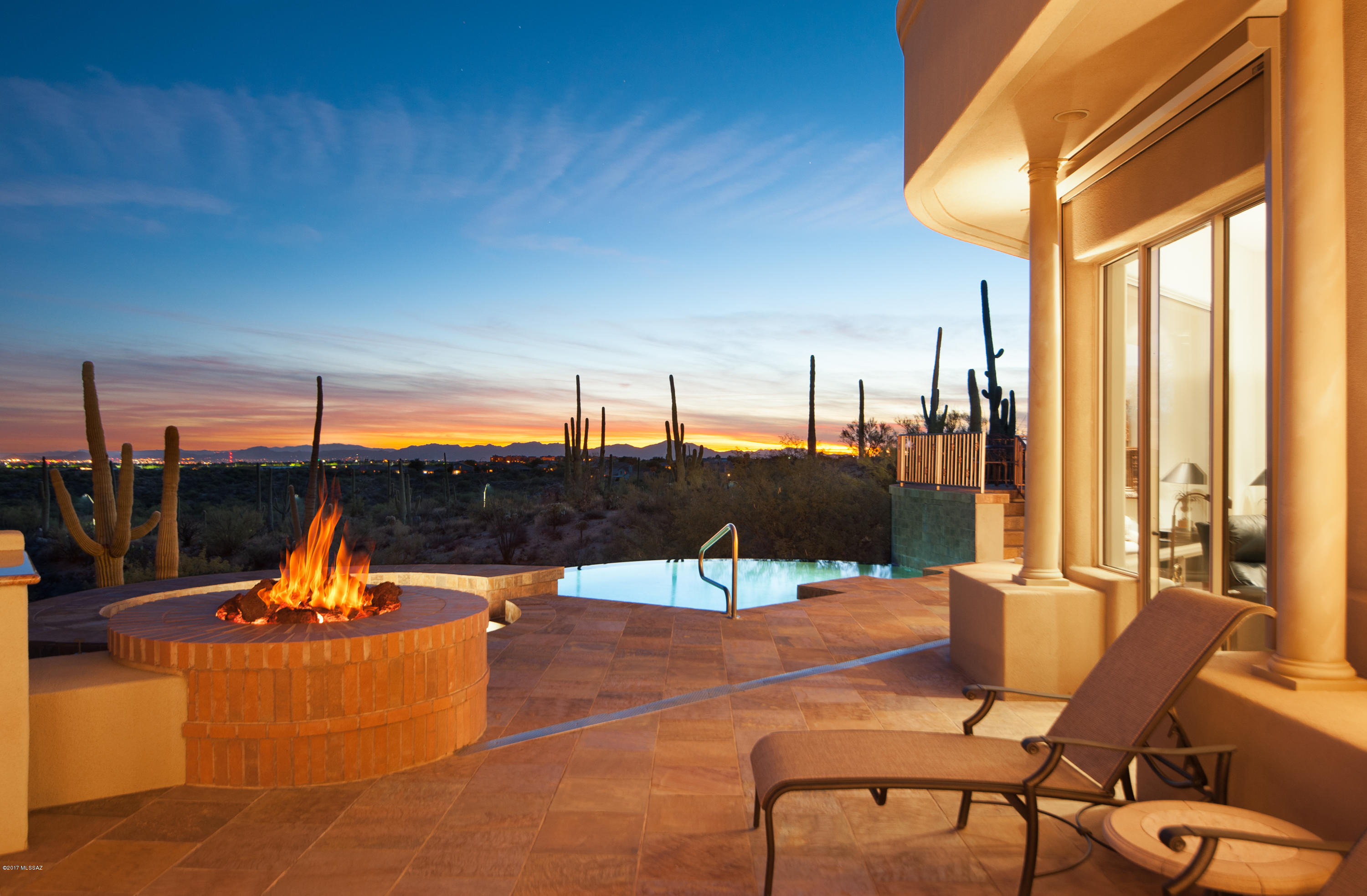 Located on an elevated 1.21 acre lot with unobstructed panoramic 180 degree views of Catalina Mountains, Pusch Ridge, Tucson Valley with City lights, and the most spectacular sunsets! A combination of contemporary and mediterranean architecture.Over 5900 sq. ft. of function and elegance with 4 bd/5/ba, state-of-the-art Theatre room and guest quarters. The gourmet kitchen features Catalina Mountain views, extraordinary detailed ceilings, breakfast nook and quality cherry cabinets with many built-in features. Quality granite counters, full size SubZero refrig. and freezer, Viking Professional stove with conventional/convection baking with double ovens. Huge chef granite island w/sitting area, warming drawer, and two sub zero refrigerators. All the Amenities!