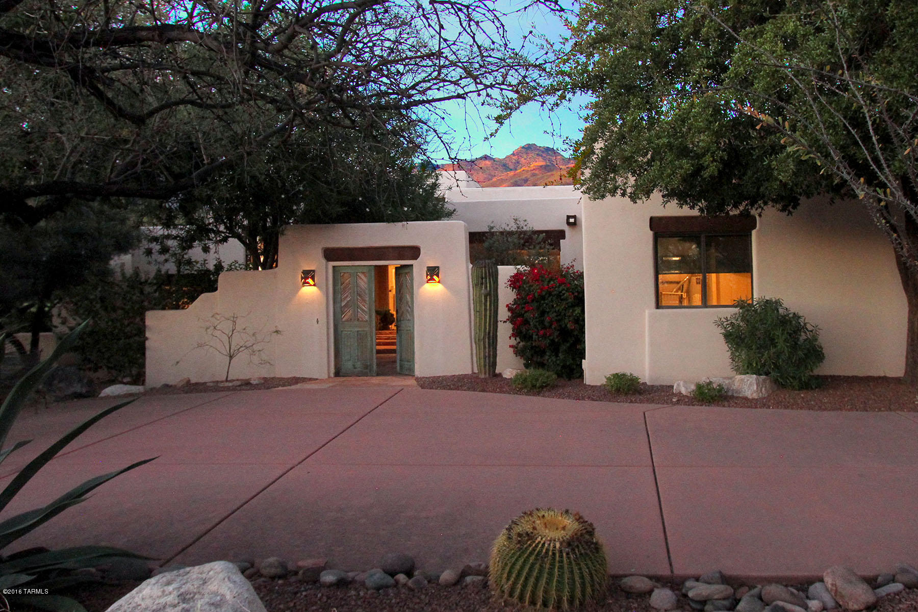 Stunning 4 bedroom plus den home on the golf course in gated Ventana Canyon Estates. Private entry courtyard with saguaro rib inset courtyard doors.  Soaring ceilings and windows in family room open to back yard with built-in BBQ, firepit with seating area, and pool with waterfall feature. Amazing golf course and Catalina Mountain views!