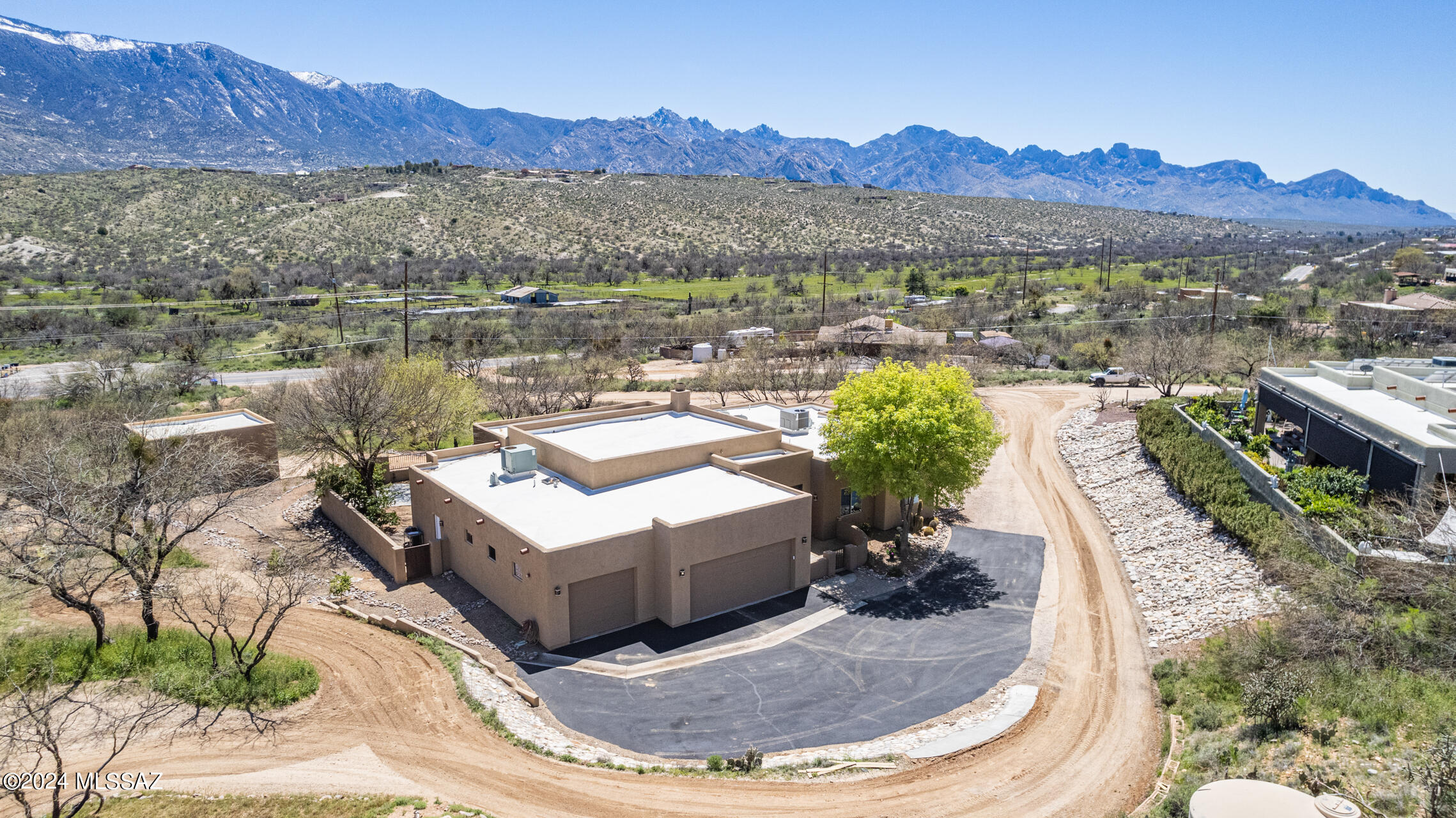 Wonderful mountain views captured from inside and out of this fabulous desert contemporary four bedroom split floor plan, three full bathroom custom home, on over one acre. High ceilings, large windows and patio doors, solid wood interior doors. Open kitchen to greatroom features solid wood cabinets with full extension drawers and pullouts, stainless appliances, granite counter tops, island breakfast bar, under counter lighting and walk-in pantry. Concrete flooring, large primary bedroom and bathroom with good sized walk-in closet. Beautifully appointed rear yard with pool, mature vegetation and terrific views. Attached three car garage, plus tandem workshop, or storage for another small vehicle. Also separate over-sized additional one car garage.