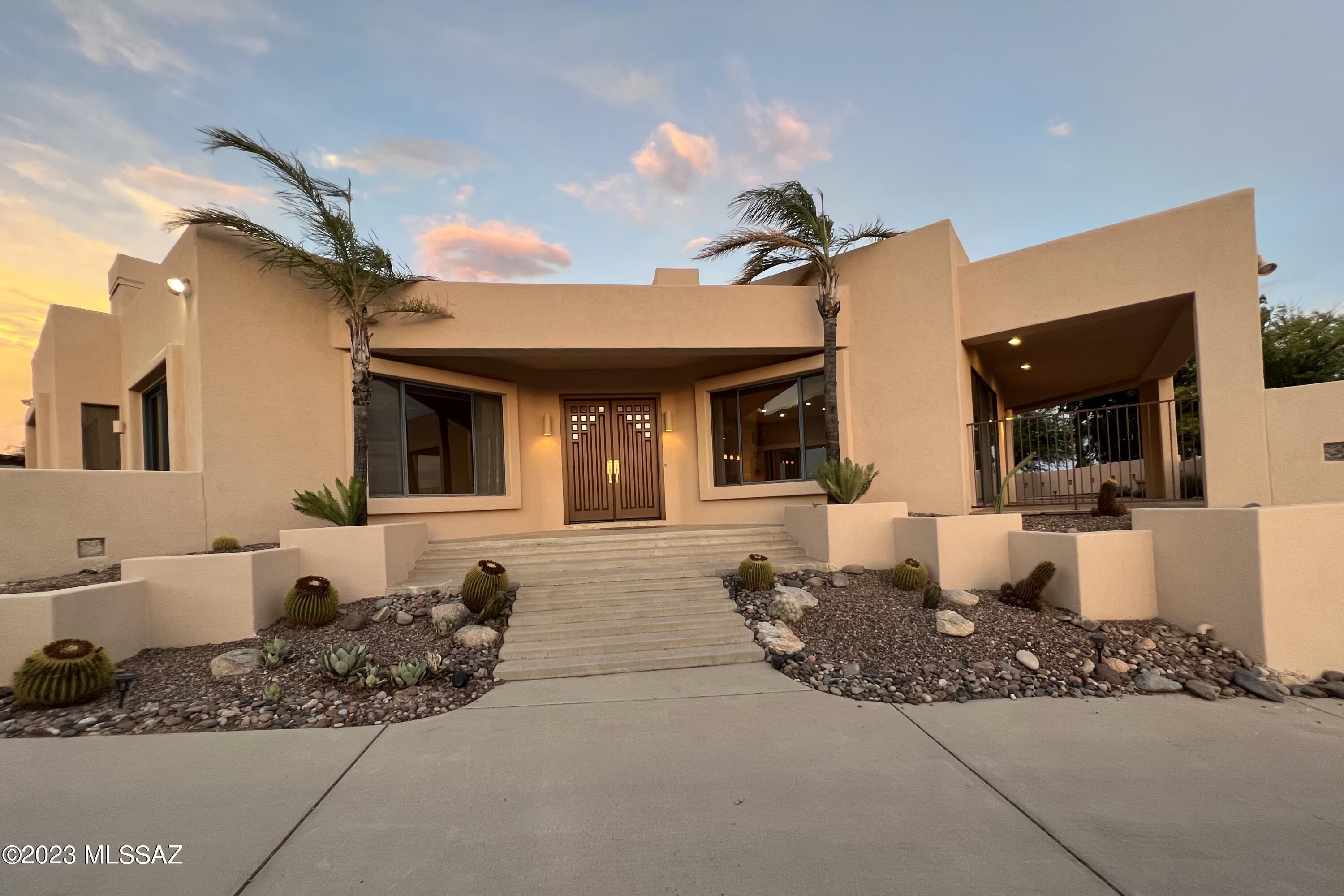 Beautiful Foothills custom contemporary home with 360 sweeping city and mtn views on an elevated 1-acre lot. 3BR plus a large den, 2 and 1/2BA, 3440 sf. Newly repainted exterior, recently remodeled primary bath, laundry rm and powder rm. Large kitchen is a chef's dream - includes Wolf 6 burners/grill range, warming drawer, 2 Subzero refrigerators, double ovens, wine cooler, oversized granite center island and abundant custom cabinets. Large primary BR has FP and 2 custom designed closets. Two guest BR with Jack & Jill BA plus great city and mtn views. 2 new AC units and a new wall split AC unit in den for extra cooling. Glazed porcelain tiles on all floors. Wonderful backyard with oversized covered patio, with a spool to enjoy the endless city and mtn views. Central vacuum conveys ''as is