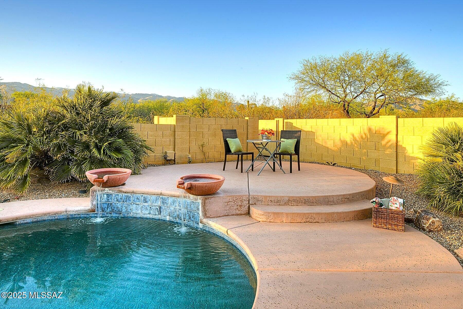 Sellers may accept or counter offers between $800K & $835K. Nestled within a gated community in the desirable Tanque Verde School District, this beautifully updated Southwest-style home offers over 3,100 sq. ft. of living space. Enjoy majestic mountain views, resort-style backyard w/sparkling pool & patio w/built-in fire pit perfect for entertaining. This 4bd/3bth home features soaring 12foot ceilings, Open floor plan, & freshly painted interior (2025). Spacious kitchen boasts quartz countertops (2024), large island with/5 burner gas cooktop & breakfast nook flowing into spacious Family Room. Additional highlights include 2 newer HVAC systems (2022) tankless water heater (2022), 3 car extended garage, new exterior paint (2024), roof replaced (2021) & recoated (2025). A true desert gem! THE PROPERTY
"	Majestic Mountain Views
"	3,128 square feet
"	Pool with waterfall feature
"	.95 acres with Enclosed Backyard 
"	 Extended Covered Patio
"	3 Car extended length Garage with high ceilings
"	Flagstone patio with built-in Fire Pit
"	Roof Replaced in 2021, recoated in 2025
"	Exterior Paint 2024
"	Gated community with quick and easy access to shopping and restaurants 
"	Tanque Verde School District 
"	Close to Parks & Hiking Trails

THE HOME
"	Southwest Style 
"	4 bedrooms & 3 full bathrooms
"	Bright open floor plan
"	Family room off Kitchen
"	Formal dining area
"	Living Area
"	12 Ft High Ceilings throughout
"	Freshly painted interior 2025
"	New Energy Star Certified HVAC Systems -2 (2022) with Reme Halo Air Purification System
"	Dual Pane Windows with custom blinds
"	Tankless Water Heater 2022
"	Quartz Counters in Kitchen 2024
"	Upgraded lighting to LED
"	Replaced ceiling Fans and Lighting fixtures
"	Solid Wood Front Door
"	Spacious Laundry room with Cabinets & Extra Storage
"	Large secondary bedrooms with walk-in closets
"	Jack & Jill Bathroom with Dual Sinks
"	Interior Sprinkler System
"	Soft close cabinets throughout house



KITCHEN
"	Bright open Kitchen 
"	Island with 5-burner gas cooktop & retractable downdraft exhaust system
"	Stainless Steel Appliances
"	Built in Oven and convection microwave
"	Breakfast Eating Area
"	Quartz countertops
"	Tall upper cabinets


PRIMARY BEDROOM SUITE
"	Spacious bedroom
"	Gorgeous Catalina Mountain Views
"	Door to Backyard Patio and Pool
"	Bathroom with dual vanities
"	Separate walk-in shower
"	Large Soaking Tub
"	Two large walk-in closets