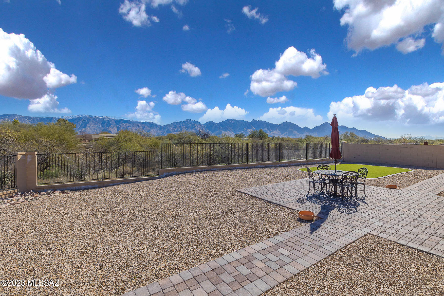 Spectacular panoramic views from this striking, highly upgraded 4BR/3.5BA (3,295 sq ft) gated home in Center Pointe Vistoso. Large cul-de-sac lot backs to Vistoso Trails Nature Preserve. Brick paver drive flows to large gathering room w/porcelain tile and 10' ceilings. Gourmet kitchen hosts island, breakfast bar/nook and high-end appliances. Enjoy a dining room, den/office and split bedroom plan w/guest & teen quarters. Upgraded Owner's suite hosts luxury bath w/huge walk-in closet. Recently painted interior. Newer flooring/appliances/LED lighting/windows/sliding patio doors/French doors. Heated/cooled 3-car tandem garage w/Tesla outlet. Extended rear patio w/brick pavers plus large turf area and view fence. Center Pointe Park has clubhouse, pool/spa/splashpad, firepit patios & playground.