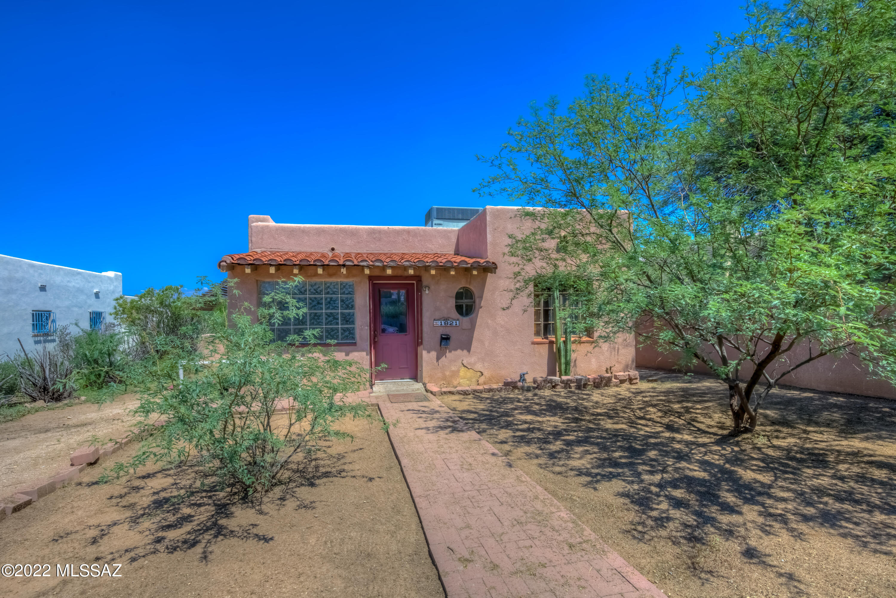 Historic 1940's fixer upper is ready for a new owner! This home features three bedrooms, two bathrooms, and is just a few blocks from the University of Arizona on an R-2 lot.  PRIME location.  Detached outbuilding/garage needs some work but has amazing potential.  Plenty of yard space for cars, toys, RV.  North/South orientation. Tidy neighbors. This home is being sold in as is condition, cash only.