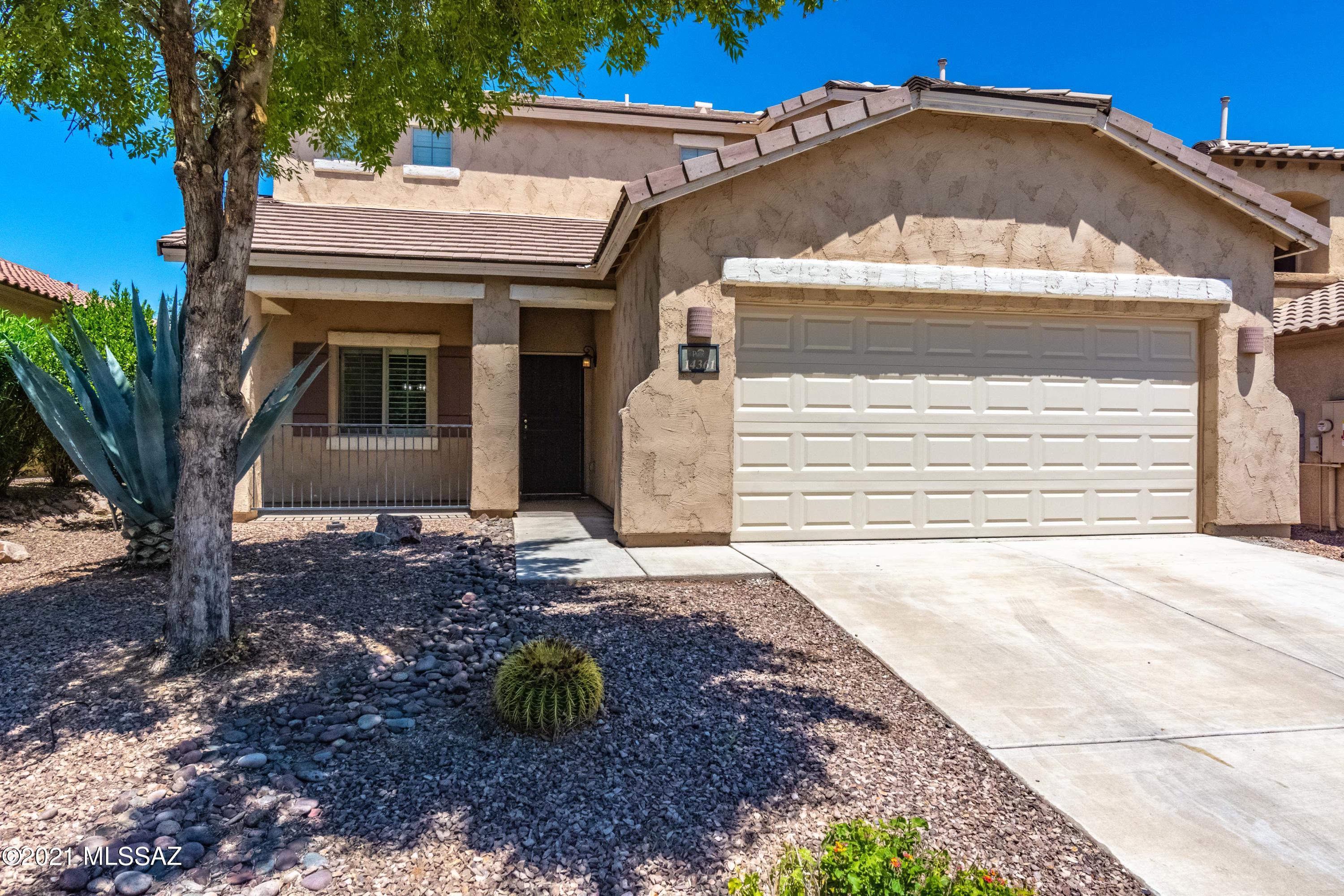 This gorgeous & beautifully maintained move in ready home sits right across a neighborhood park in the award-winning community of Rancho Sahuarita.  Immaculate and upgraded home features many extras including 5 bedrooms, 3 full baths, upgraded lighting throughout, new granite counters in kitchen and bathrooms, new backsplash, huge stainless steel sink, stainless steel fixtures and appliances, full bath and bedroom downstairs, new wood look tile, custom shutters, completely landscaped backyard, and a very private backyard oasis perfect for gatherings and entertaining! Enjoy your extended patio where you are able to take advantage of full afternoon shade, East facing backyard.  Come view before its gone!  Homes like this do not come on the market often!