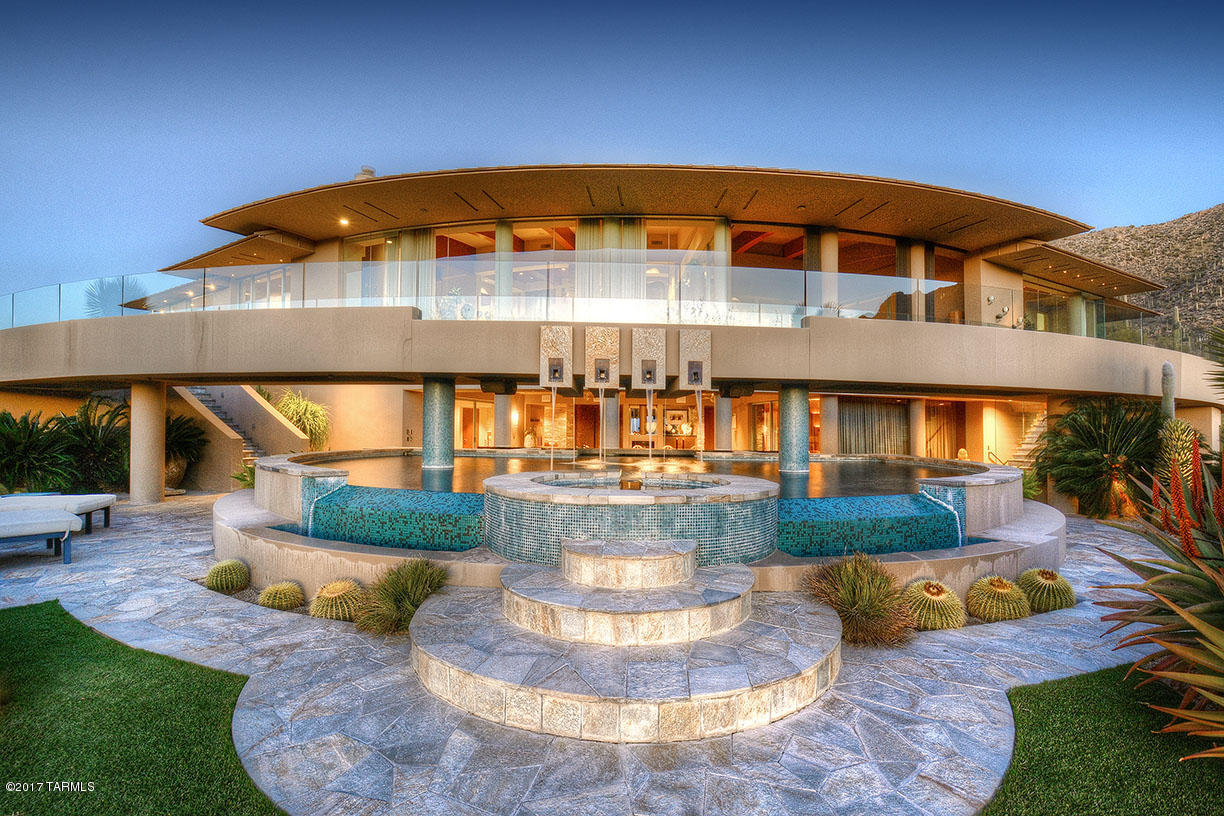 $2 MILLION DOLLAR PRICE REDUCTION!! Fabulous contemporary gated estate in Ventana Canyon Mountain Estates with amazing ''top of the world'' views at an amazing price. Truly stunning, elegant yet comfortable with spacious terraces, a bridge walkway across the tiled pool and spa, rare cactus garden in the auto court upon arriving. In addition to a spectacular master suite and 2 guest suites, home has a covered indoor-outdoor full bar, entertainment room, exercise room, massage salon, art studio, and office. Tucson's finest contemporary!