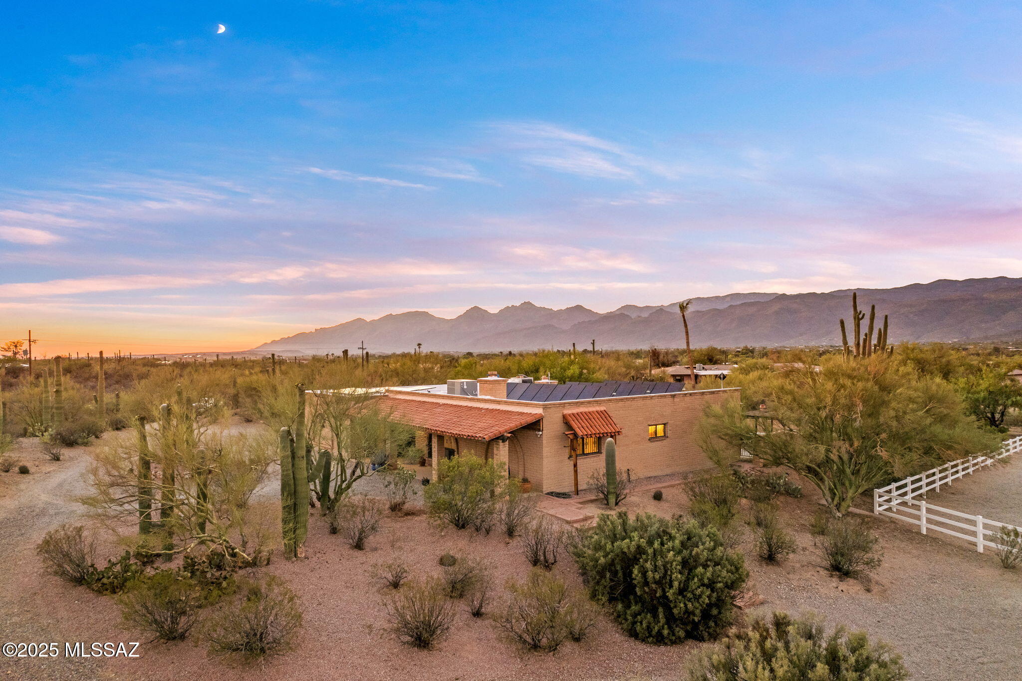 Sustainable Ranch Retreat! Classic ranch-style home on 3.53 acres in the Tanque Verde Valley. Riding distance to Saguaro National Park Eat & surrounded by natural desert beauty. The saguaro-studded lot offers sweeping mtn views & privacy behind a gated entry. Horse facilities include 6 covered barn stalls, addt'l uncovered stalls, tack room, 50 ft round pen, turnouts & arena. The detached garage/workshop features water/electric for partial RV hookup. The solar-powered home includes 2 EV outlets & 3 Tesla Powerwalls. StarLink highspeed internet 196 mbps! Split bdrm floorplan plus a flexible 5th room off the laundry. Separate liv & fam rooms, each w/ their own fireplaces. Breakfast bar & formal dining. There's room for everyone! So much charm & character, it just feels like home!