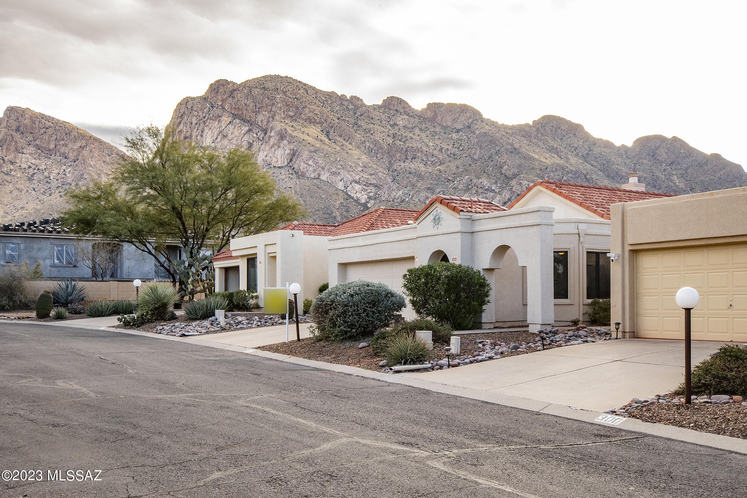 Perfect 2BR/2BA in a quiet, highly desirable neighborhood in Oro Valley on a Cul-De-Sac lot.  Well-kept home with many upgrades, including a new roof, new Low-E Anderson windows, upgraded cabinets, Quartz Ceasar Stone countertops, a new cooktop stove/convection oven, and a new screen metal door front door.  The Interior features an open floor plan with vaulted ceilings, a dual fireplace, and double doors leading to an office or den, which can be converted to a third bedroom.  The main bedroom leads to the covered patio and private yard with six-foot walls for privacy.  Close to Oro Valley Country Club, bike and hiking trails, multiple golf courses, medical facilities, shopping centers, restaurants, and much more!