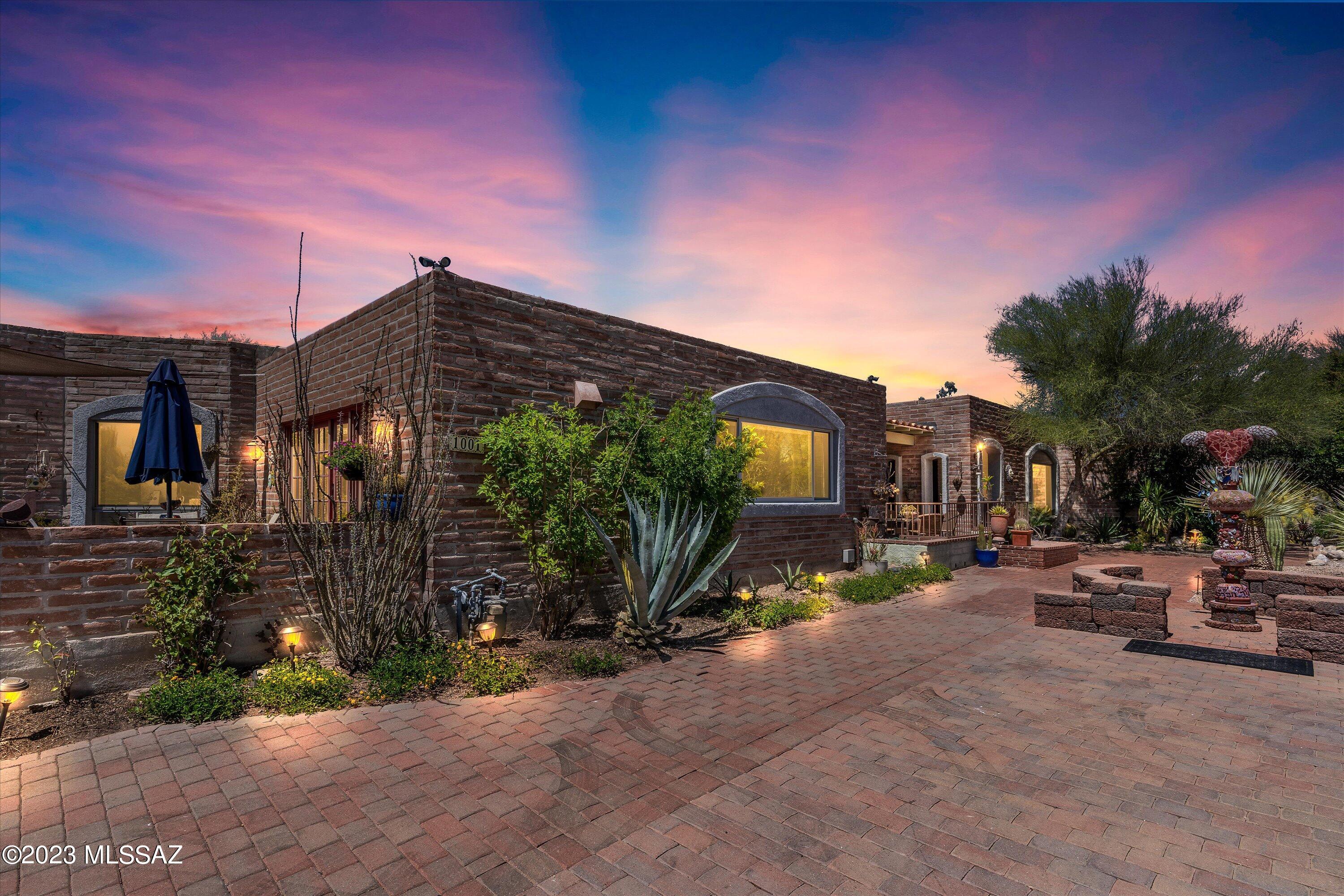 Gorgeous custom home in Foothills Estates with breathtaking mountain views. Main home boasts 3 bedrooms PLUS a mother-in-law suite. Custom stained concrete flooring, venetian plastered walls, & one of kind architecture throughout. Primary suite bathroom designed by Grygutis & Co. & is complete with a Jacuzzi tub, walk-in shower with steam, built-in storage, huge closet, & bidet. The kitchen is a dream with Thermador Pro 6 burner stove with hood & griddle, Thermador built-in fridge, Subzero fridge drawers, built in microwave, enormous kitchen island with built in flatscreen & a butler's pantry! This home has 5 patios, a ramada with storage, & a sparkling pool with pebble-tech jacuzzi. Guest house was built by Tom Mancuso Construction & designed by Frank Westerbeke. This home is a must see!
