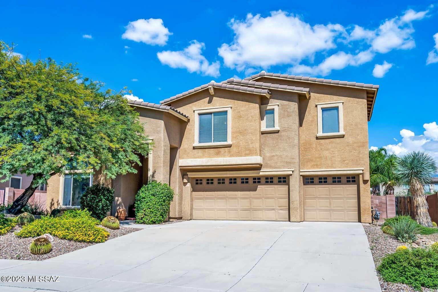 UPDATED MAY 2023 WITH NEW SMART 18 SEER2 HVAC and NEW SS KITCHEN APPLIANCES AND QUARTZ COUNTERS. Must see 4581sqft 5BR/3.5BA home boast Catalina Mountain views from inside & out, the privacy of a wash, a heated pebble-tec pool w/ waterfall on a lush east facing backyard that enjoys the afternoon shade & much more. Soaring ceilings in the foyer & living rm that opens into dinning rm. Plus lg kitchen, guest ensuite, a Great room w/ gas fireplace & wet bar, laundry rm & 3 car garage w/ storage system. Upper level, a luxury owner suite w/ plantation shutters, dual walk-in closets, split vanities, deep soaking tub & separate shower. Additional 3 bedrooms w/ 9ft ceiling, a full bathrm, a huge bonus room & lg balcony with breathtaking views. Nearby bike loop & Top rated public & charter schools.