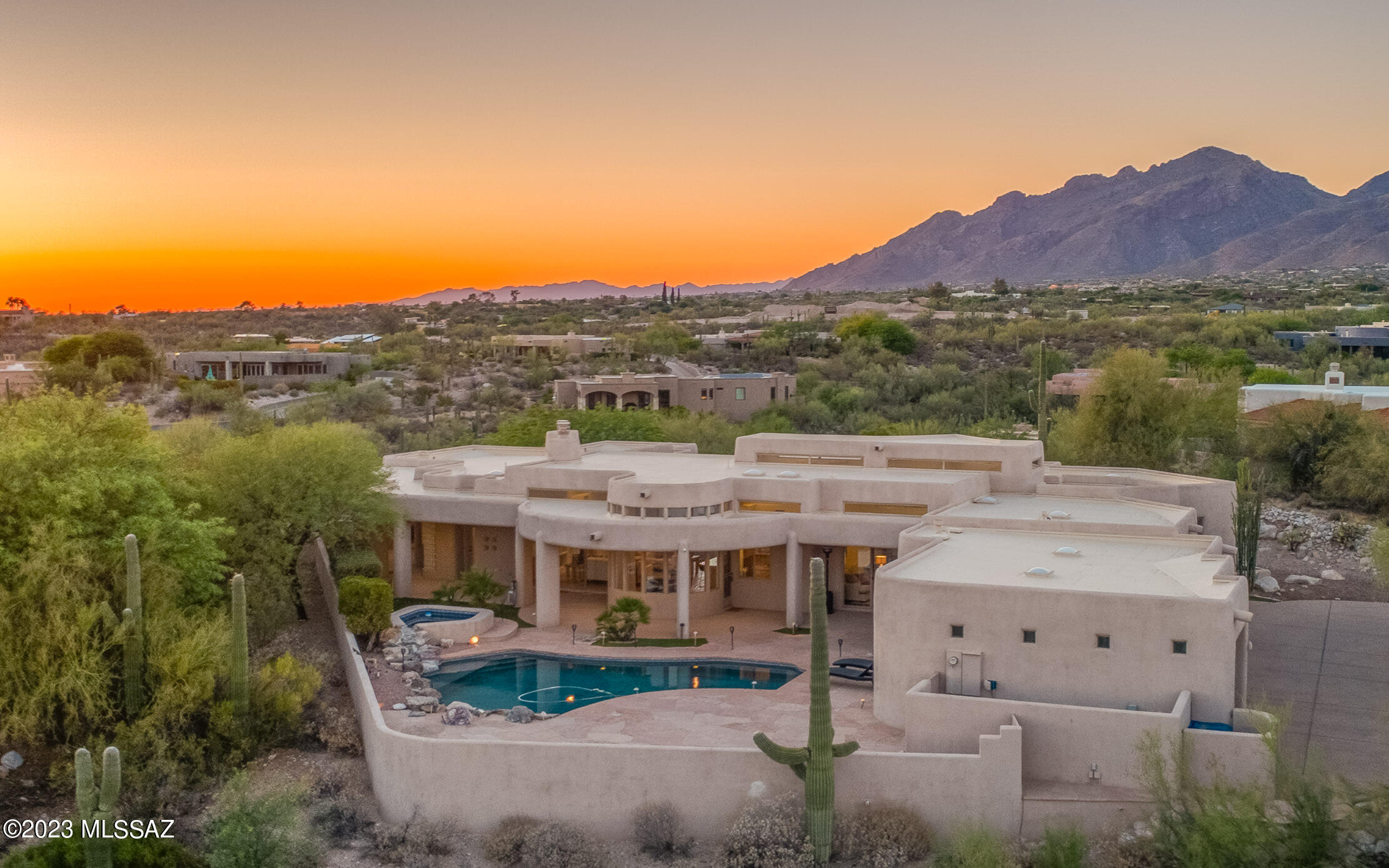 Hacienda Del Sol Estates Finest! Step into pure luxury with spectacular location, pristine views & a stylish contemporary vibe! This estate sits atop a pristine view lot with stunning city and mountain views galore. Inside you are warmly welcomed with soaring ceilings, sparkling natural light & a feeling of peace. The kitchen is gourmet grade and opens to the family room & backyard. There is tons of room to entertain with deep covered patios and infinity views overlooking the city below! The primary suite is a true retreat with spa like bathroom, expansive walk-in closet & bonus office attached looking at the magnificence of the Santa Catalina mountains. The split floorplan allows for privacy & comfort for all! Guard gated & perfectly located, this estate feels a world away!